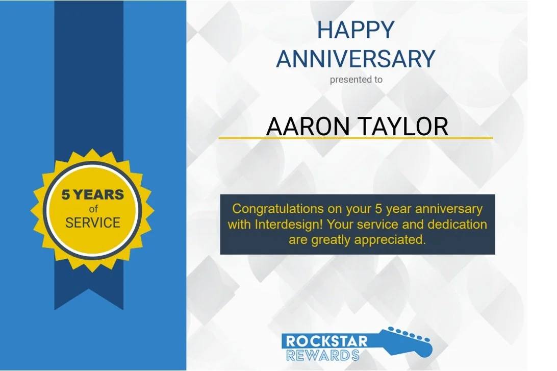 An anniversary certificate with a blue and white background, celebrating Aaron Taylor's 5-year service with Interdesign, featuring a badge that says '5 Years of Service' and the Rockstar Rewards logo, with a message of congratulations on the service and dedication.