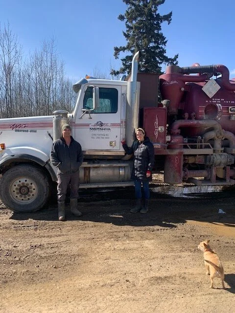 Carmen and Dwayne Richter standing beside Mistahiya Contracting’s pump truck in Chetwynd, BC