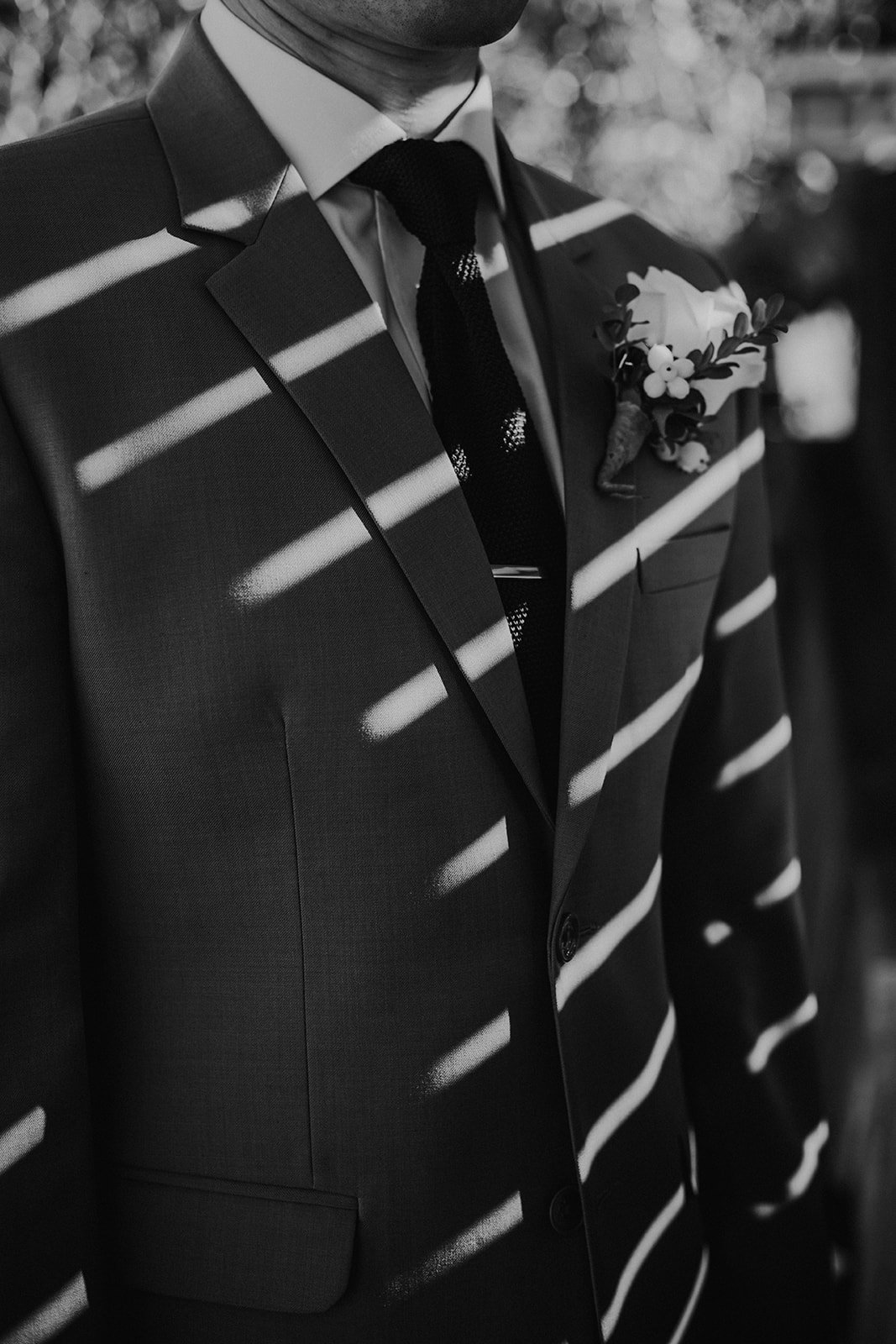 A creative portrait of a groom on his wedding day at UBC Boathouse in Vancouver. Wedding photography by Sea to Sky Studios.