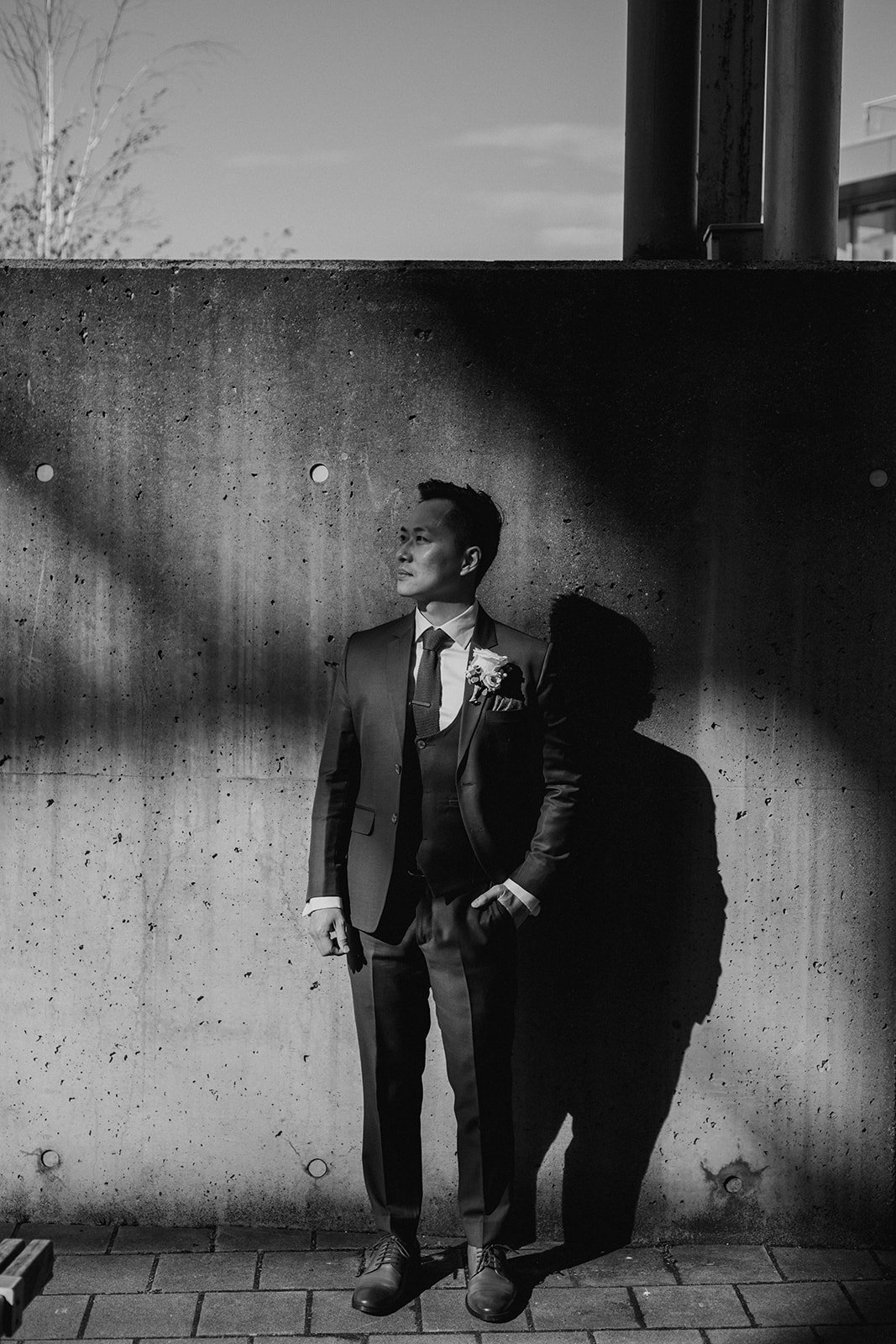 A wedding portrait of an Asian groom at UBC Boathouse. Wedding photography by Sea to Sky Studios.