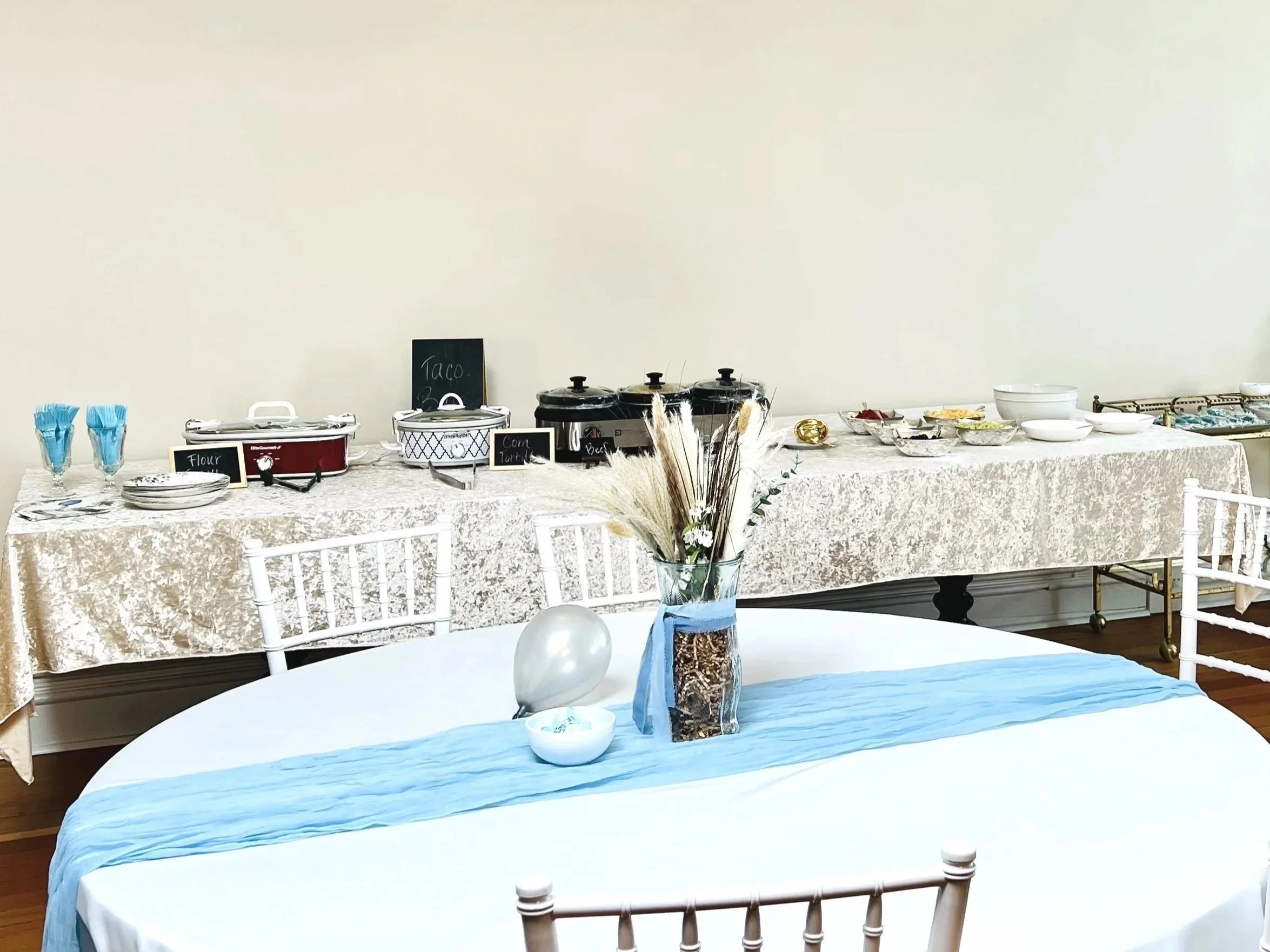 The 10' dining table is moved up to the wall and becomes the serving table for a buffet, charcuterie, desserts, drinks and more. 