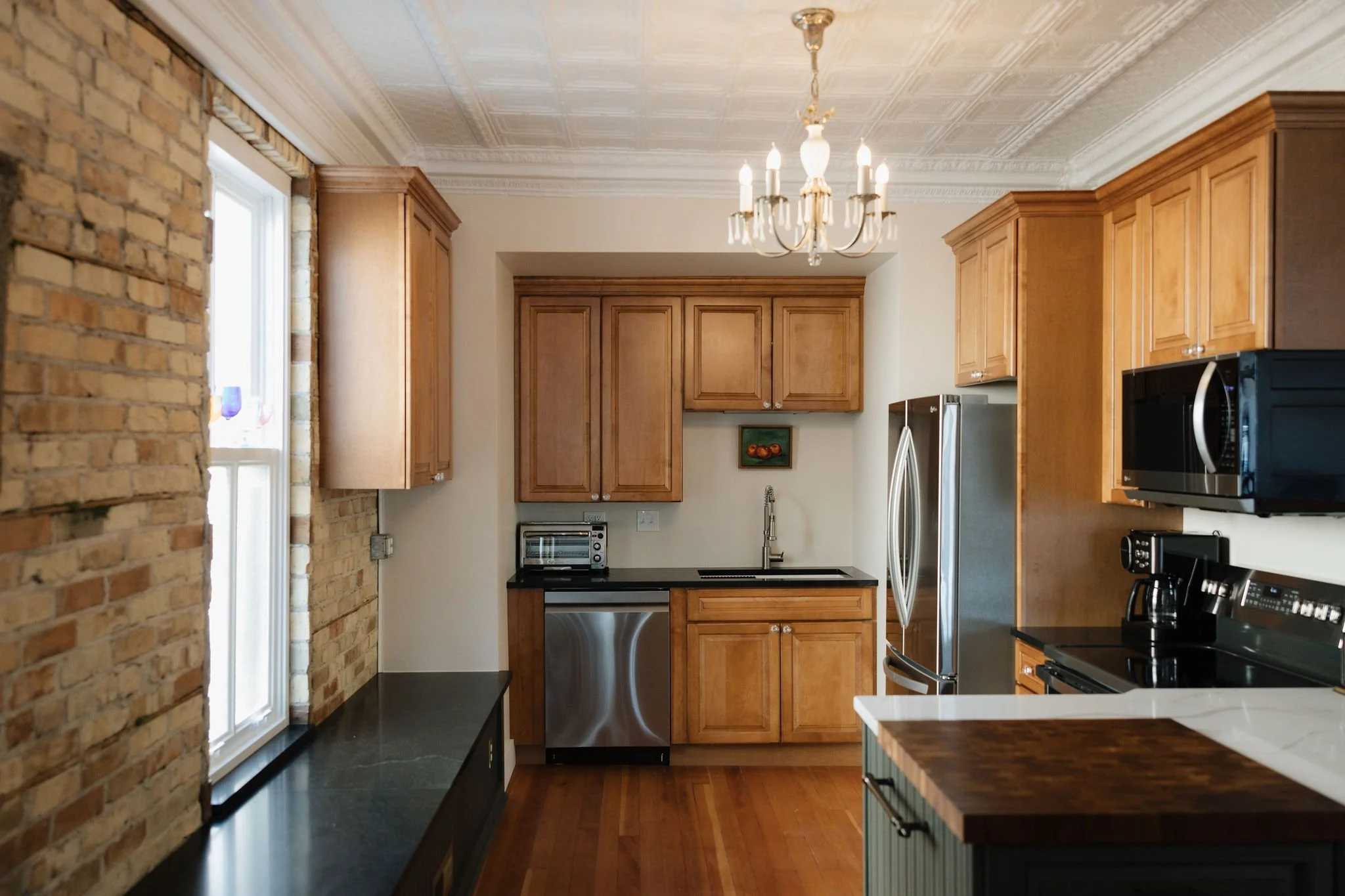 Full kitchen on the 2nd floor, available for use in specific rental options.