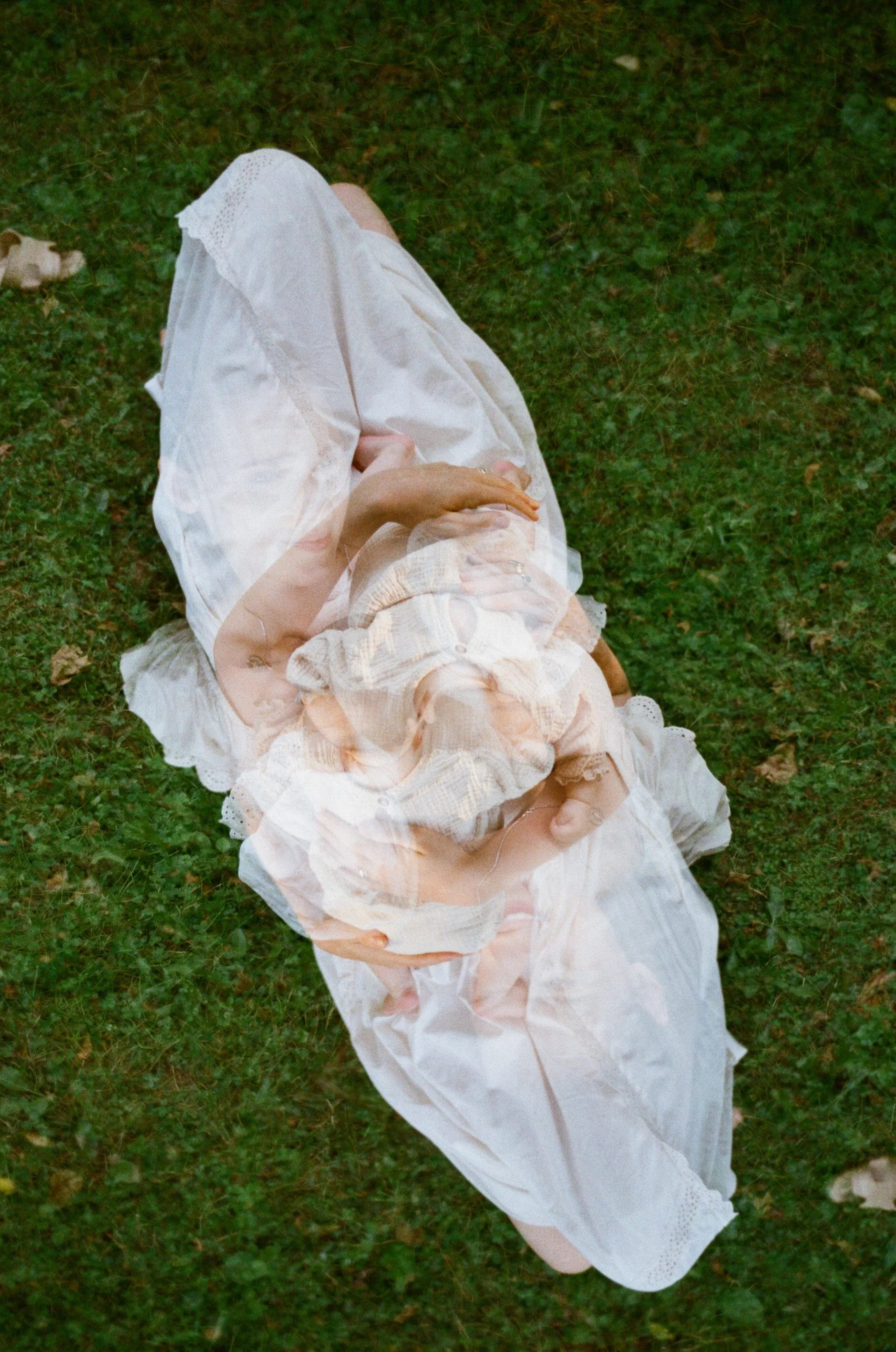 Experimental film photography of mother and newborn at home on film