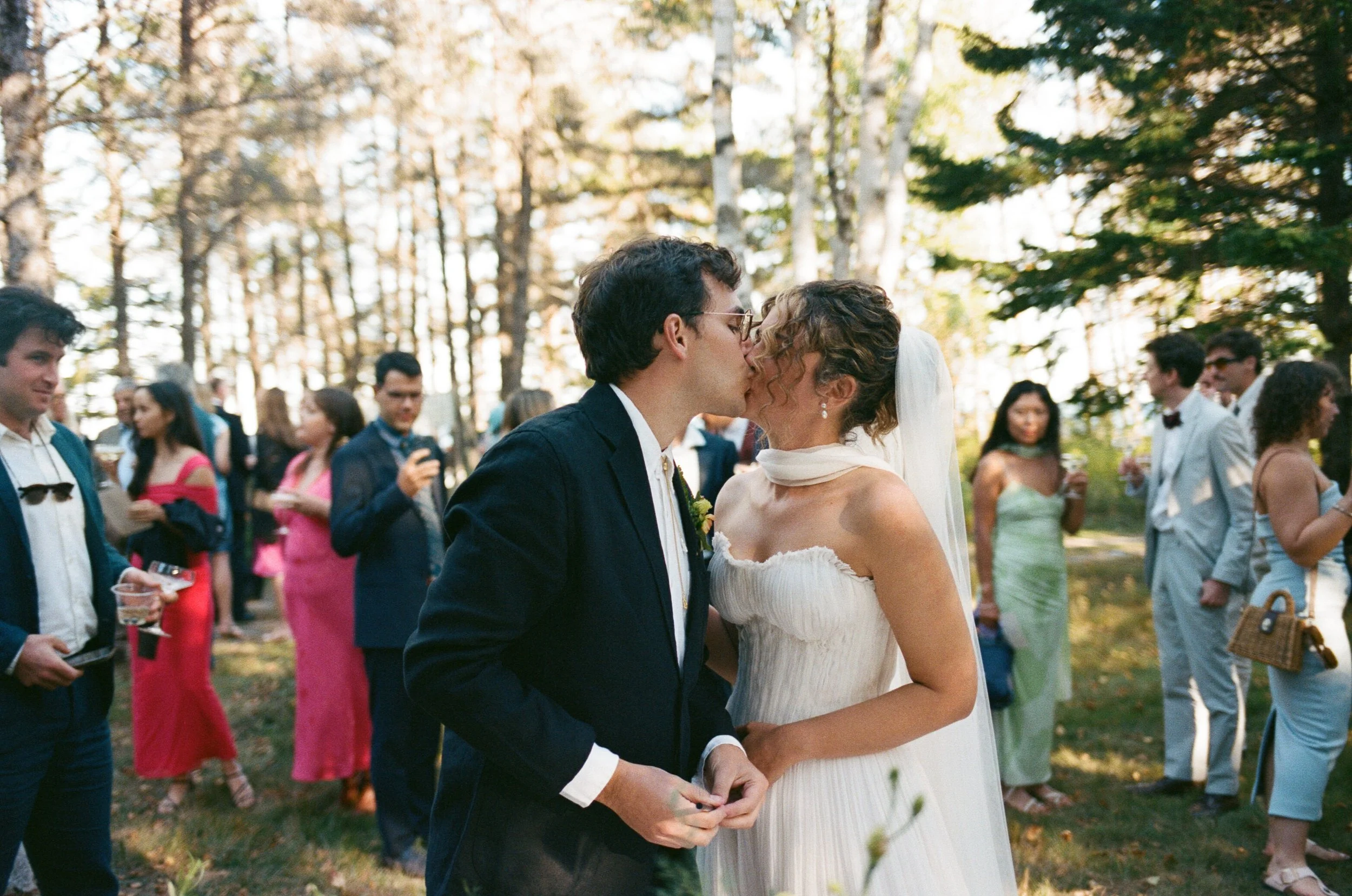 a couple exchanges a kiss after signing their marraige license at a wedding in downeast maine