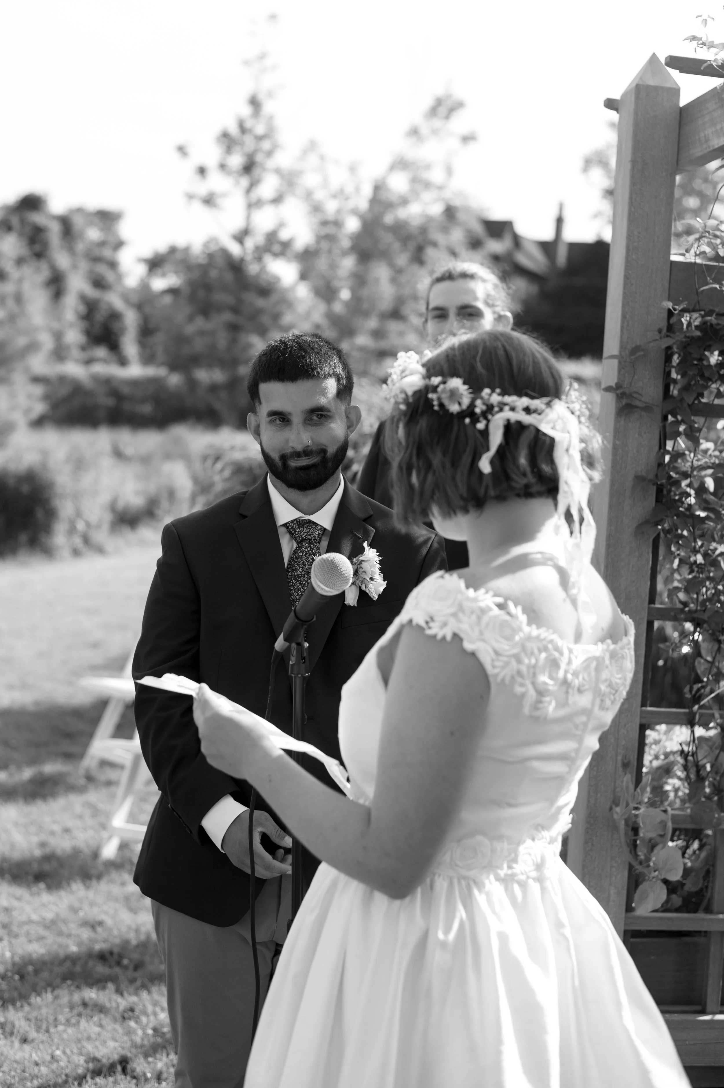 ceremony during mid-summer backyard wedding in rhode island