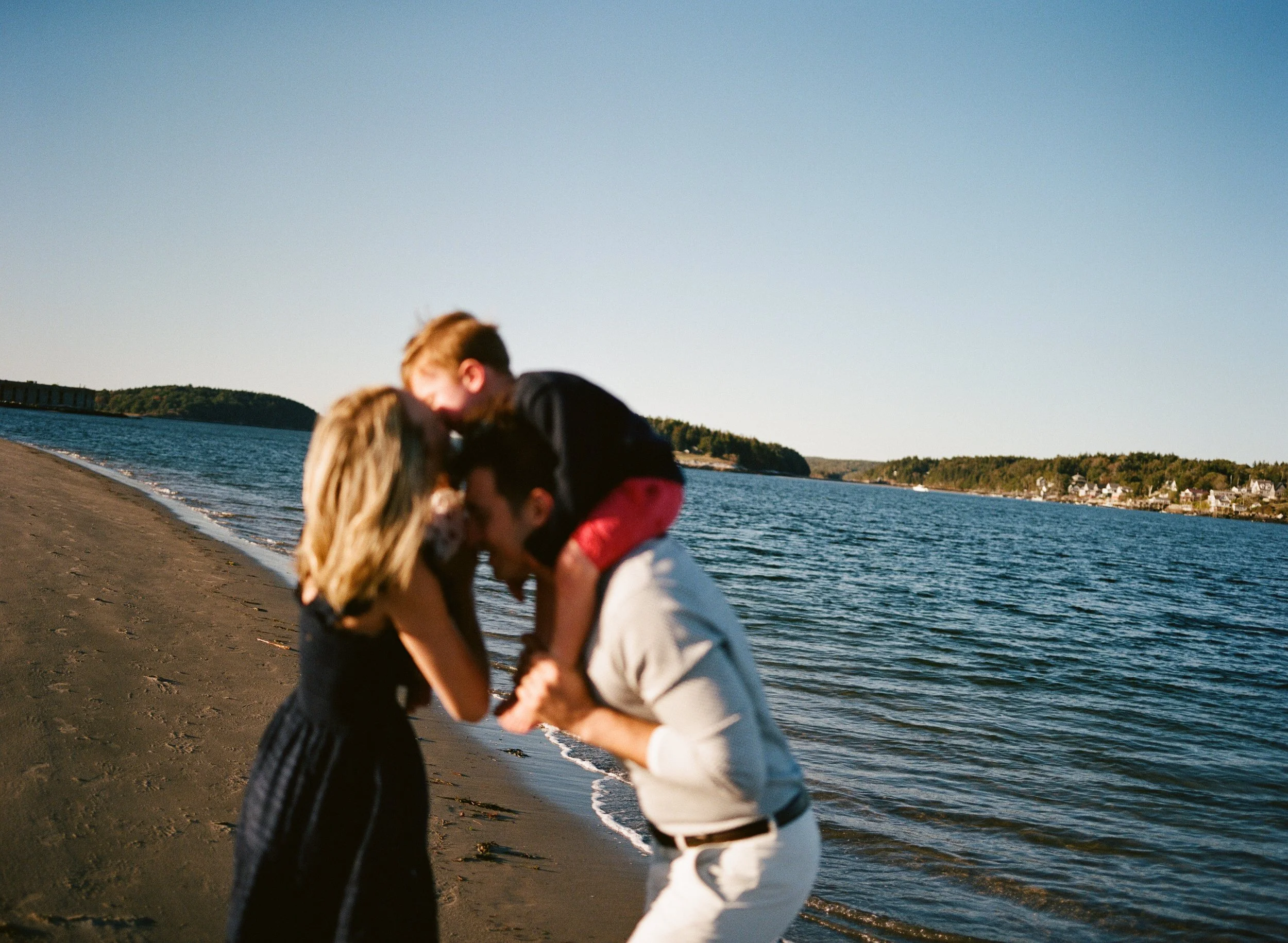 a family snuggles during a session in maine