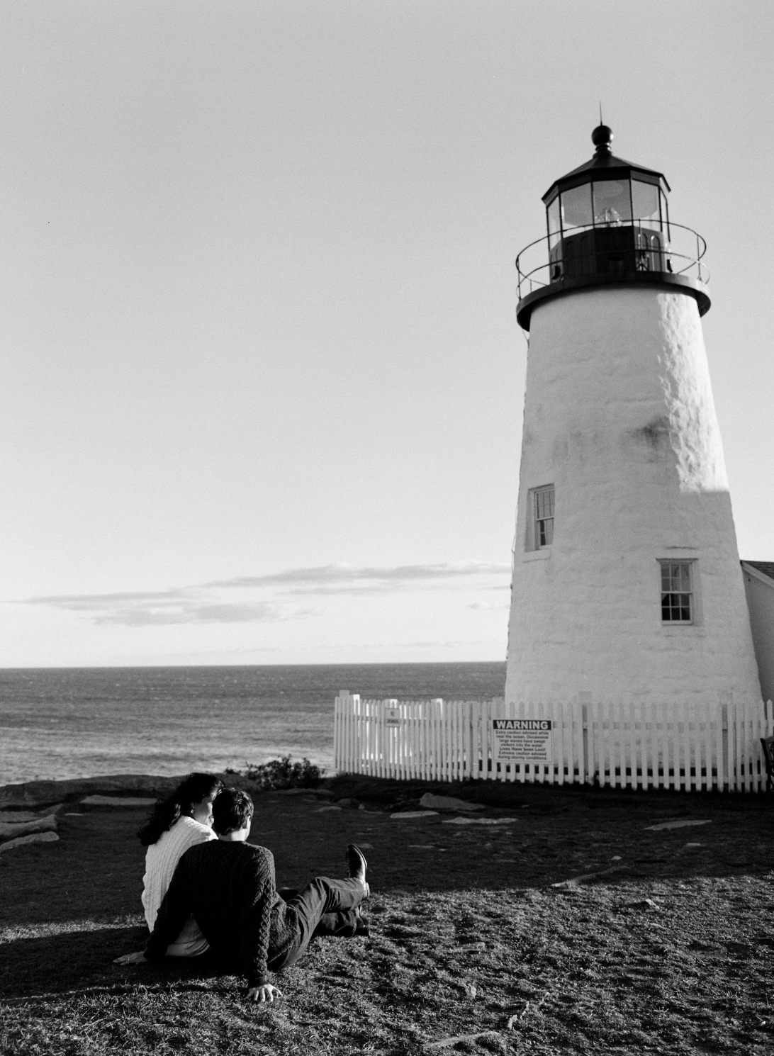 couple looking at pemaquid lighthouse during elopement in midcoast