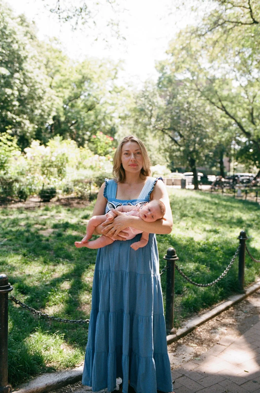 laid back documentary photograph of a mother holding her newborn in Brooklyn