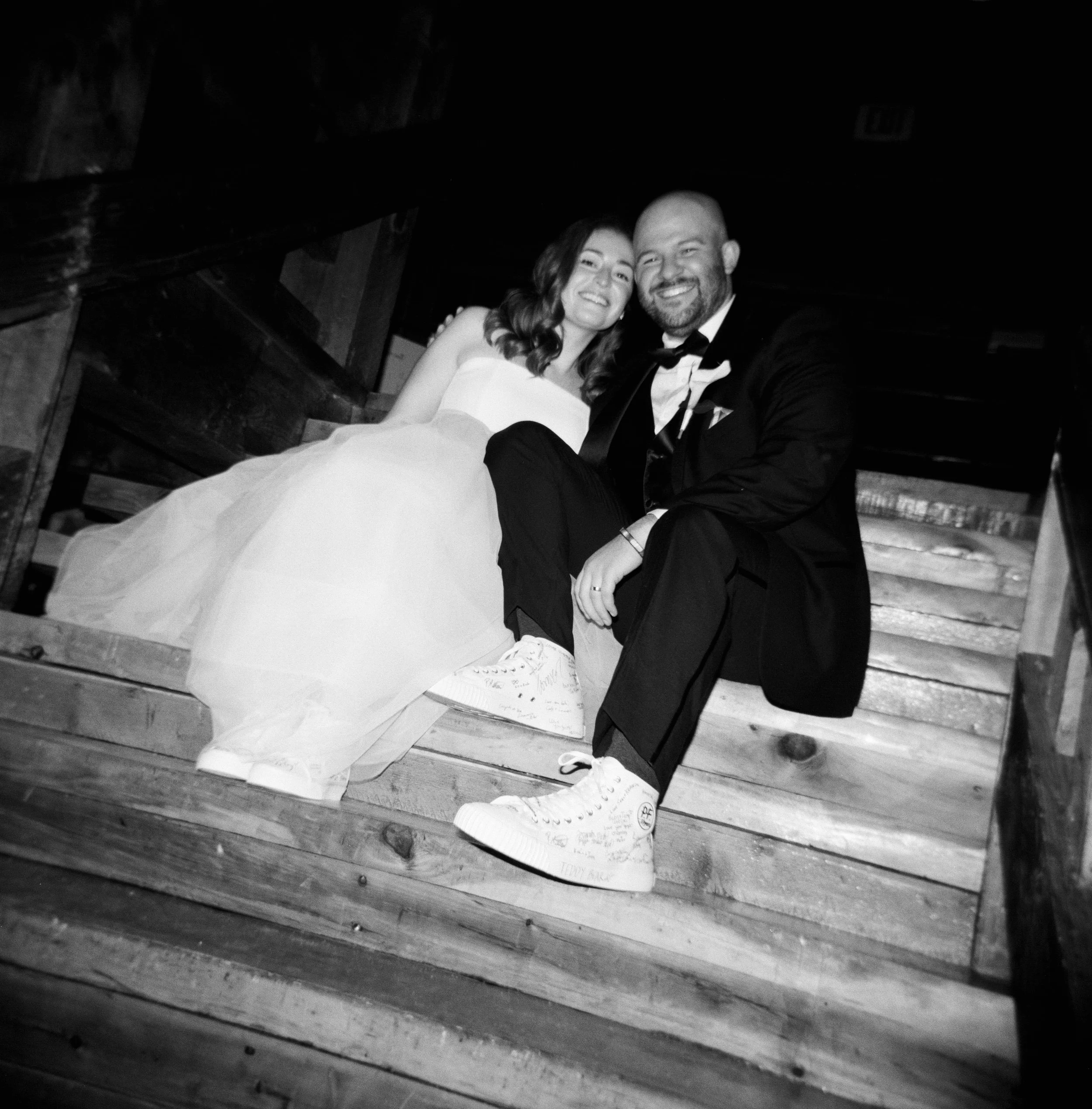 film photo of bride and groom wearing custom wedding converse