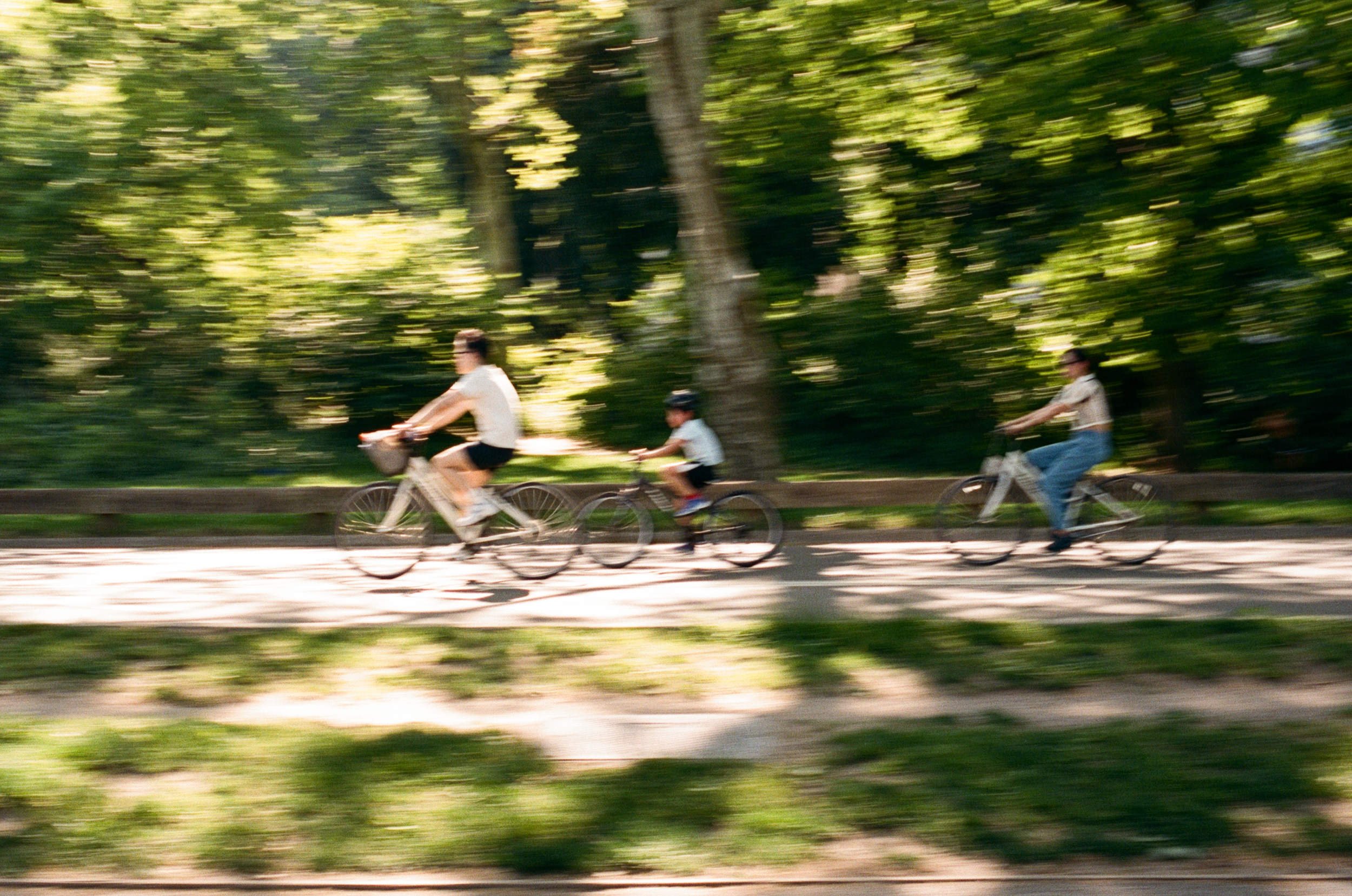 Central park family film photography of family bike riding