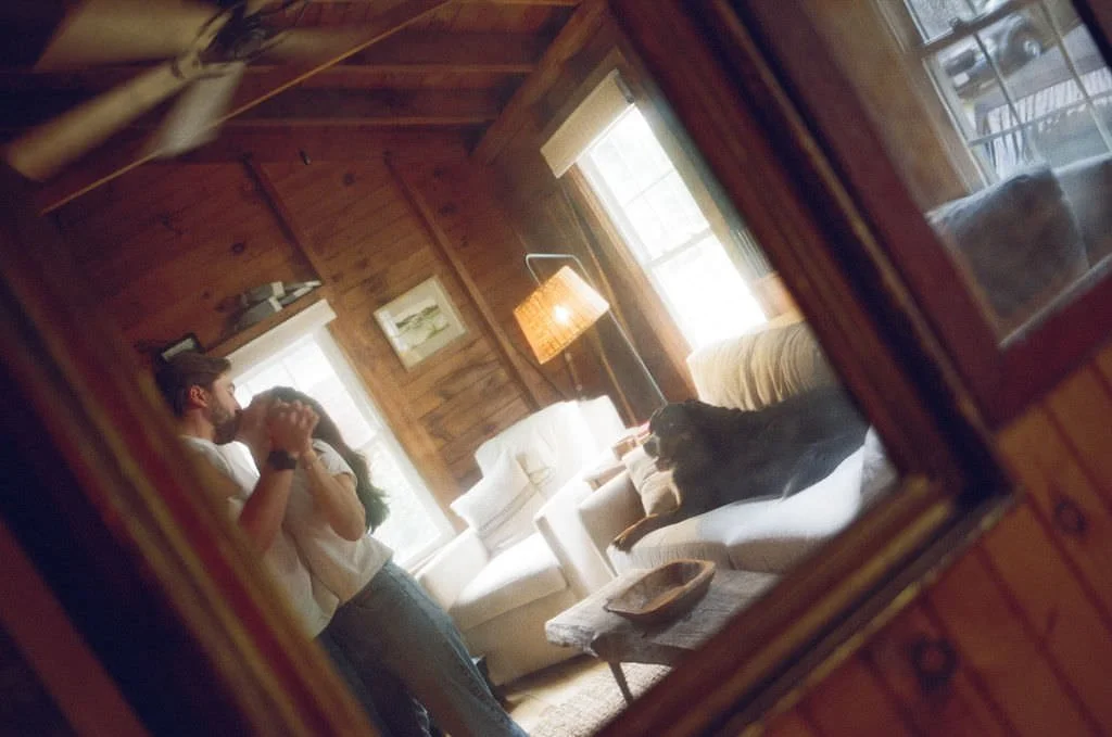 a couple dancing candidly at home in southern maine