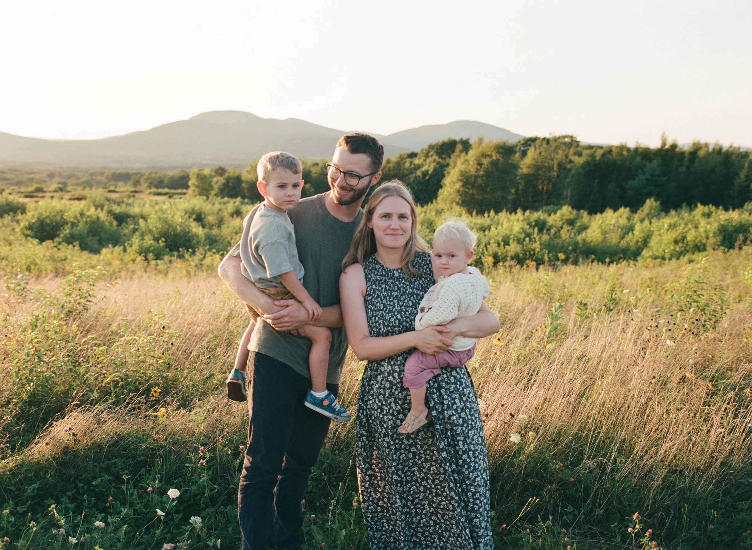 a family portrait on beech hill in maine at sunset on film
