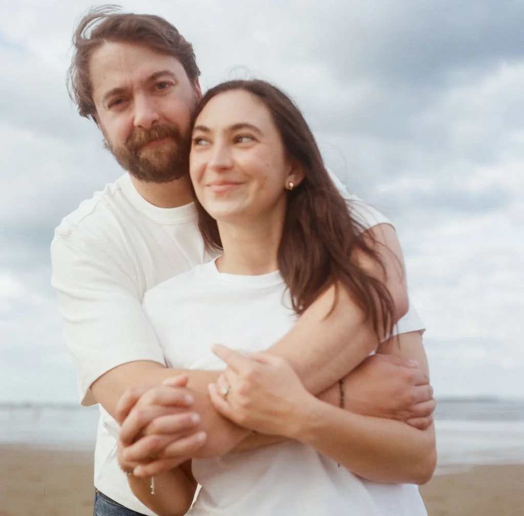 dreamy film portrait of a couple hugging in southern maine