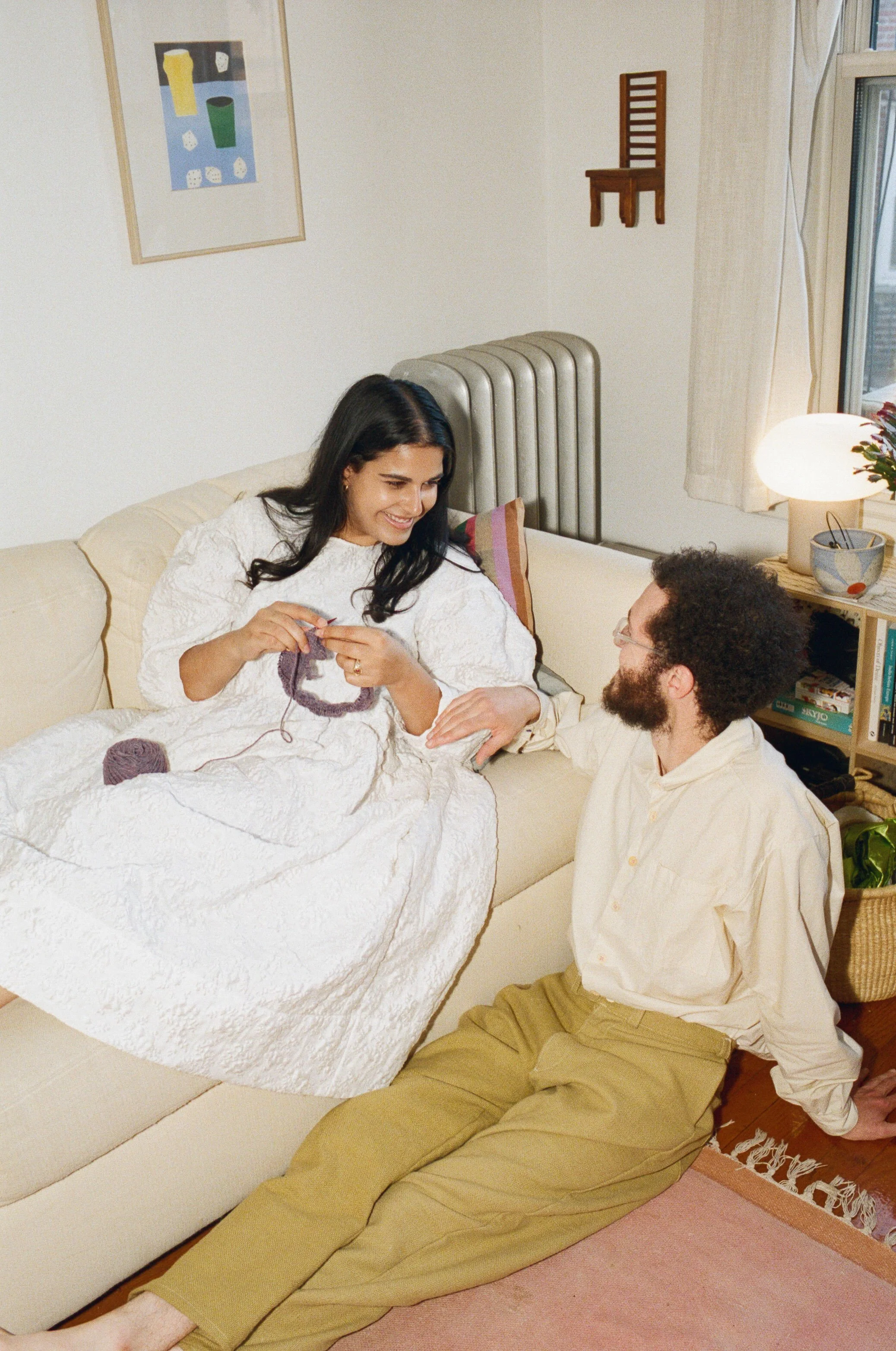 candid engagement photography couple knitting at home in boston
