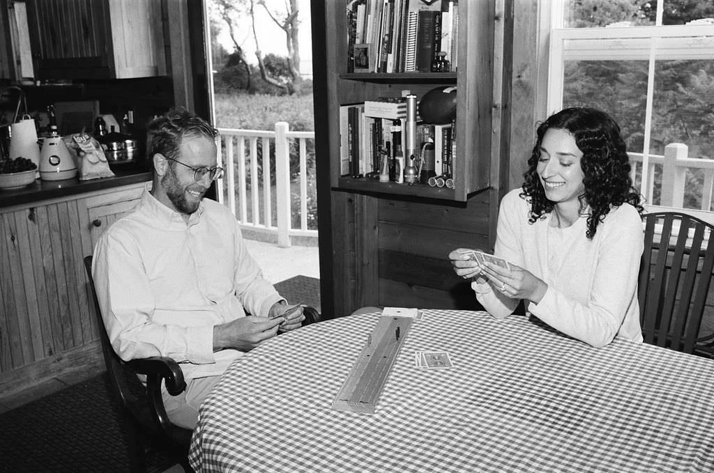 documentary engagement photography playing cards at home in maine