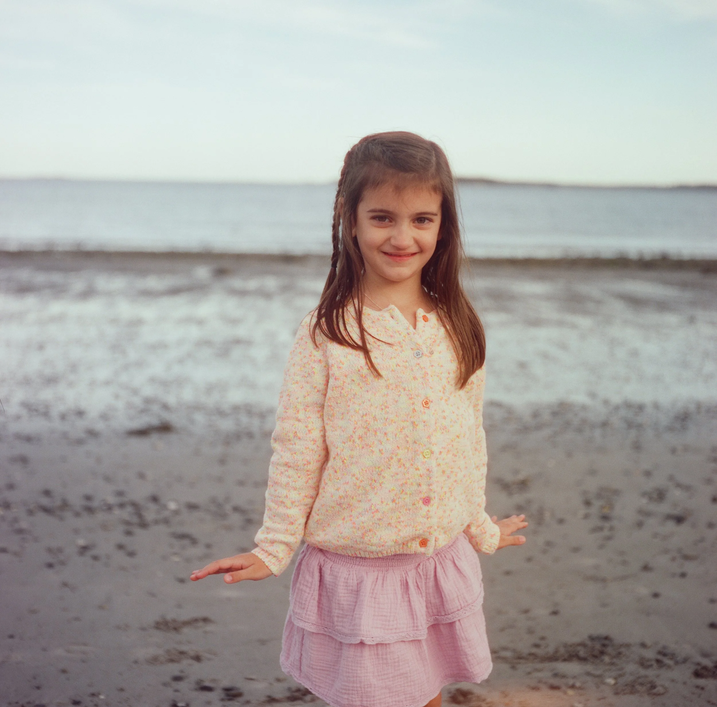 A little girl photographed on film at the beach in Maine