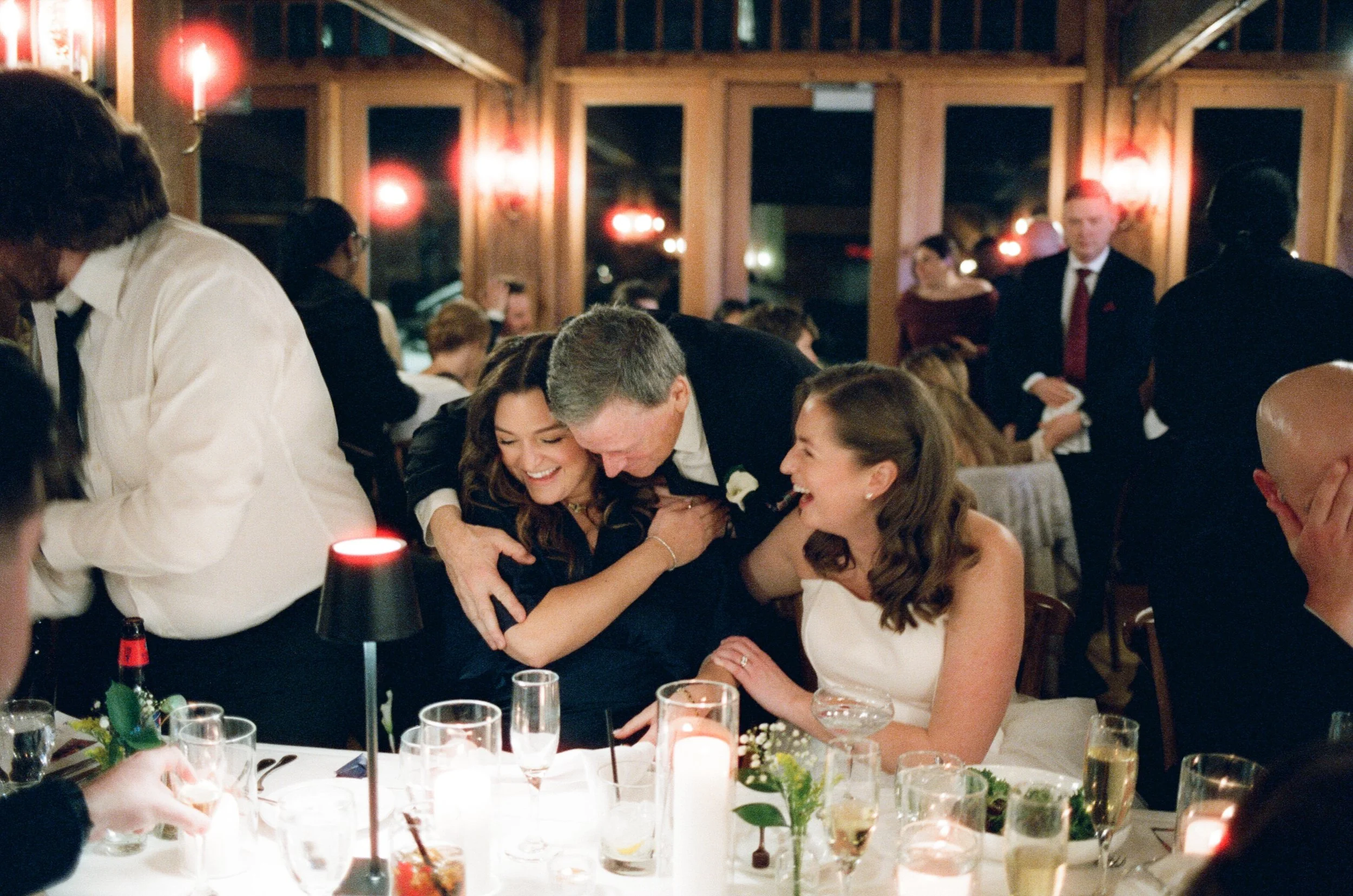 bride, maid of honor, and dad laughing