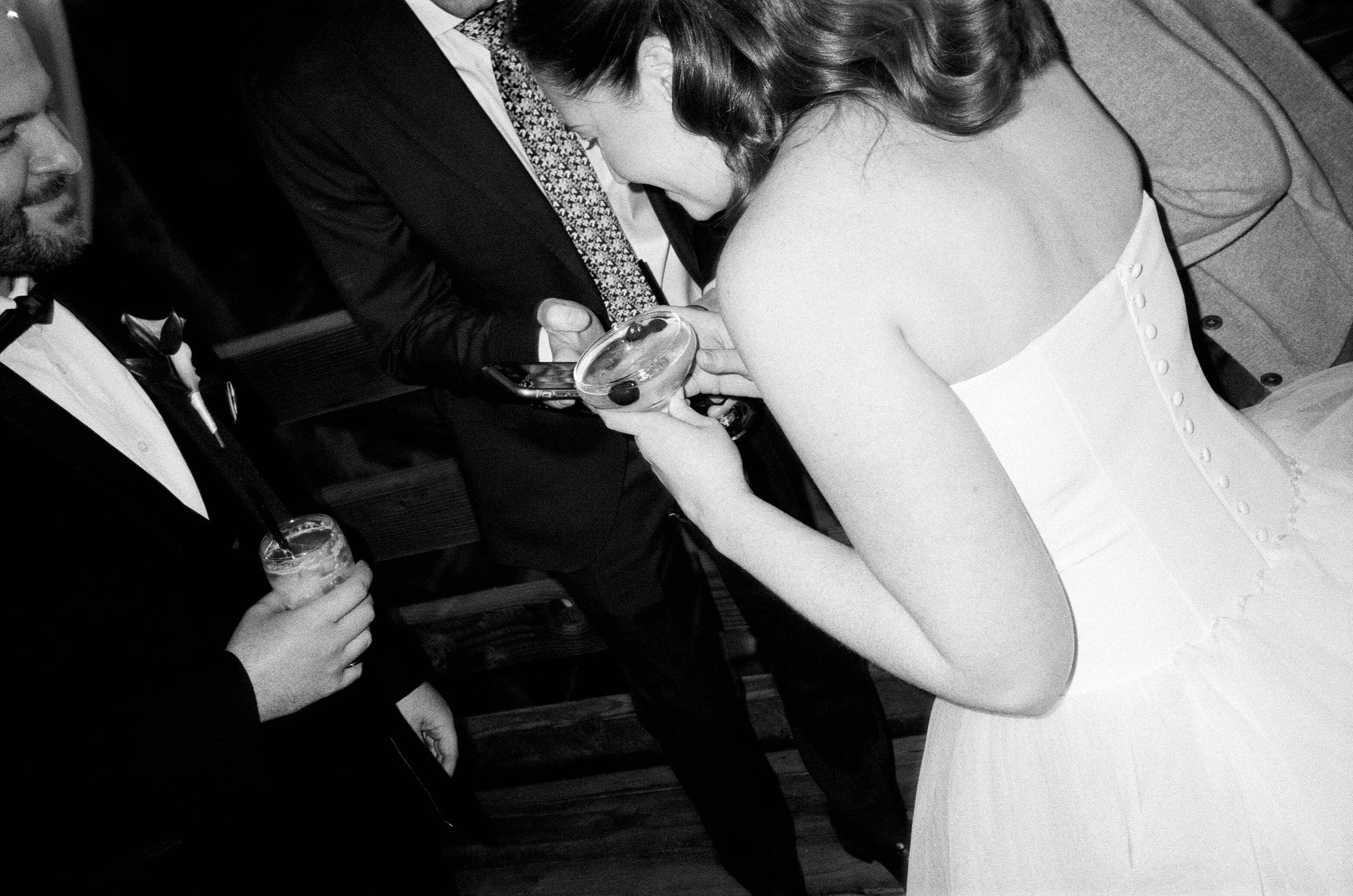 bride holding cocktail