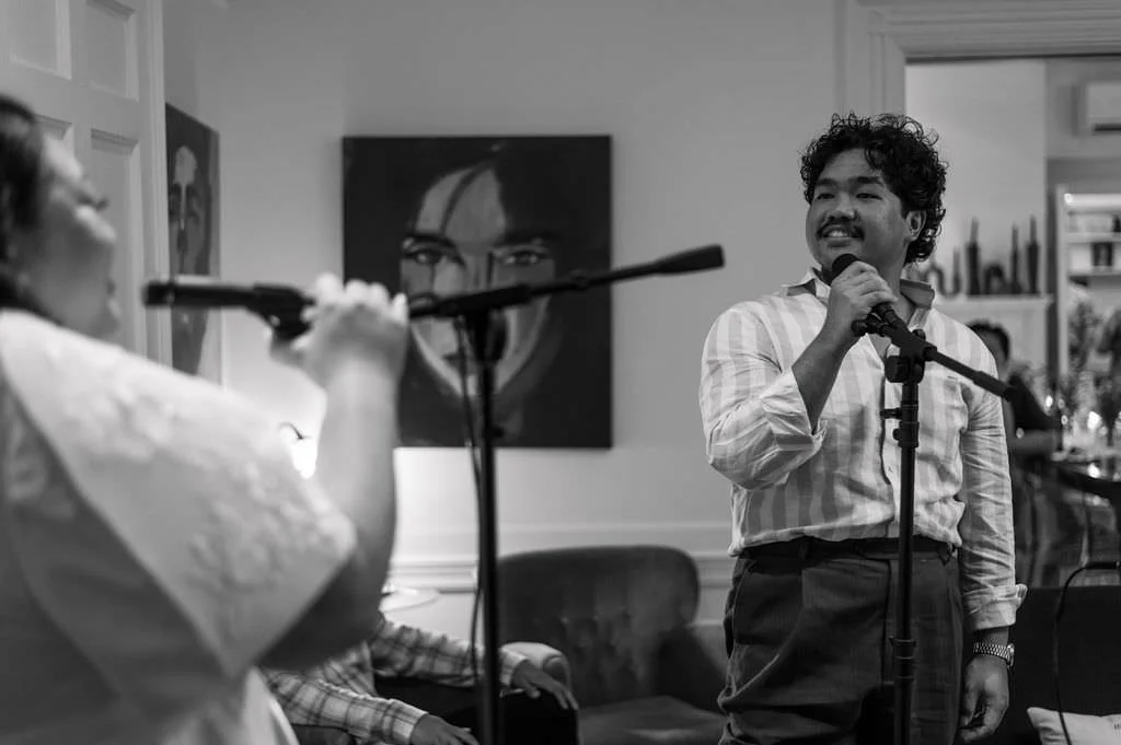 a couple singing karaoke at intimate wedding in maine