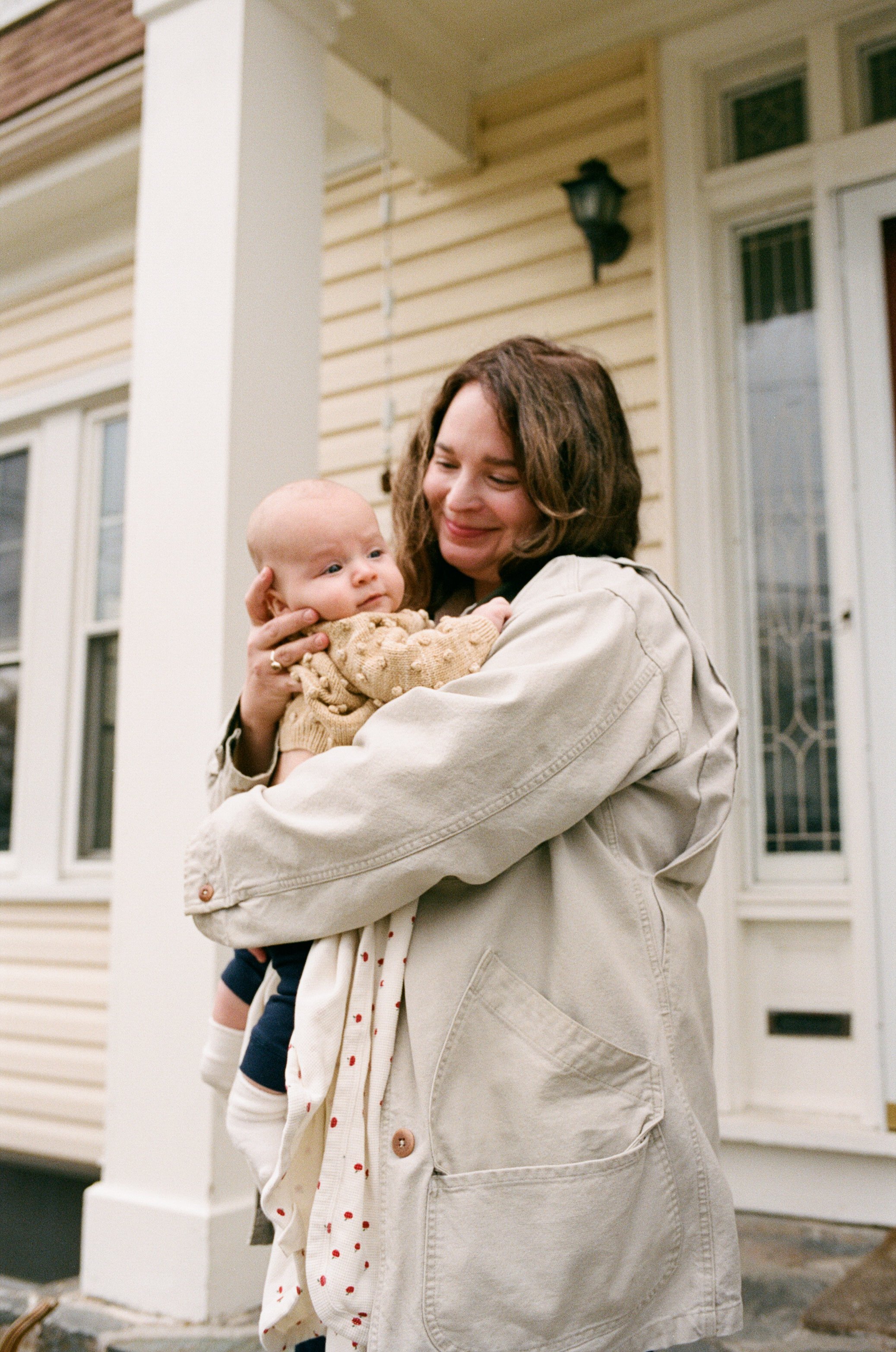 mother and newborn at home on film