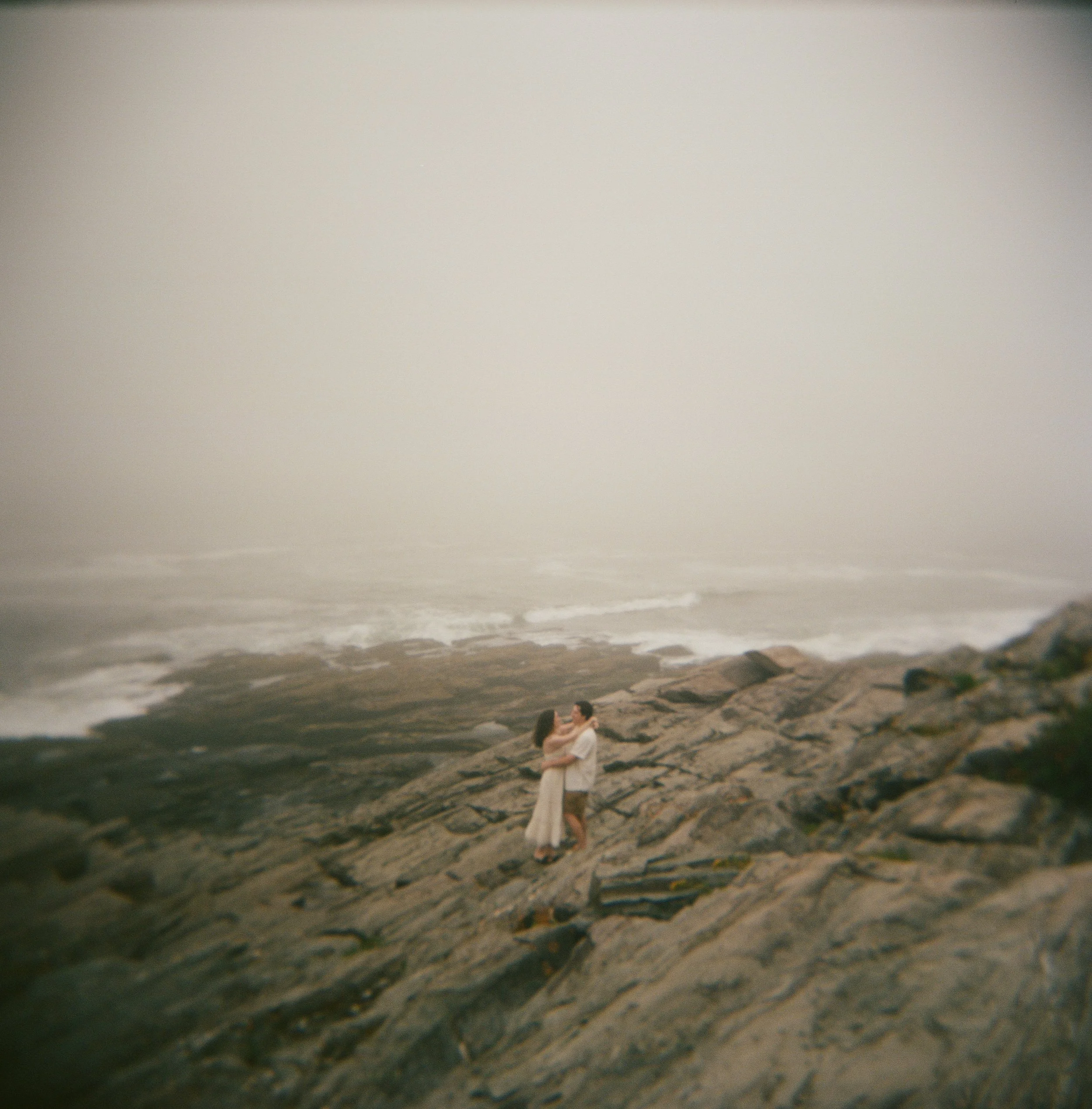 a moody engagement session at two lights state park