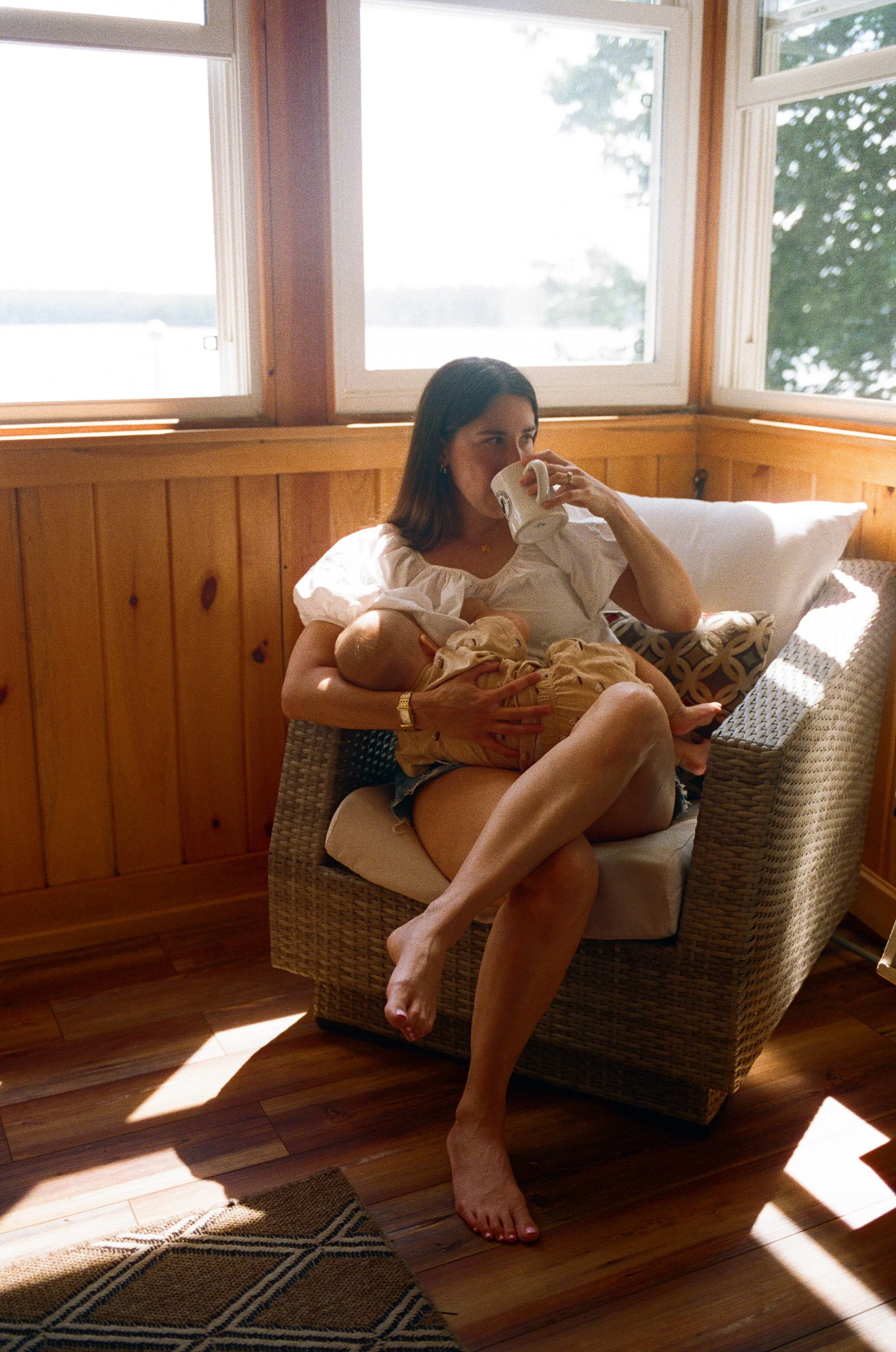 Family photography session in southern Maine on film, mother with baby natural, laid back portraits on the porch at home
