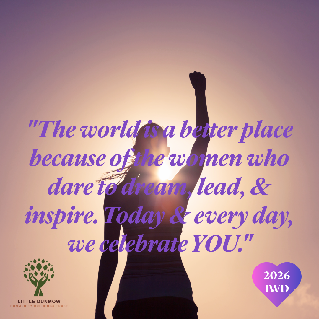 A woman celebrating an achievement with her arm up in the air.