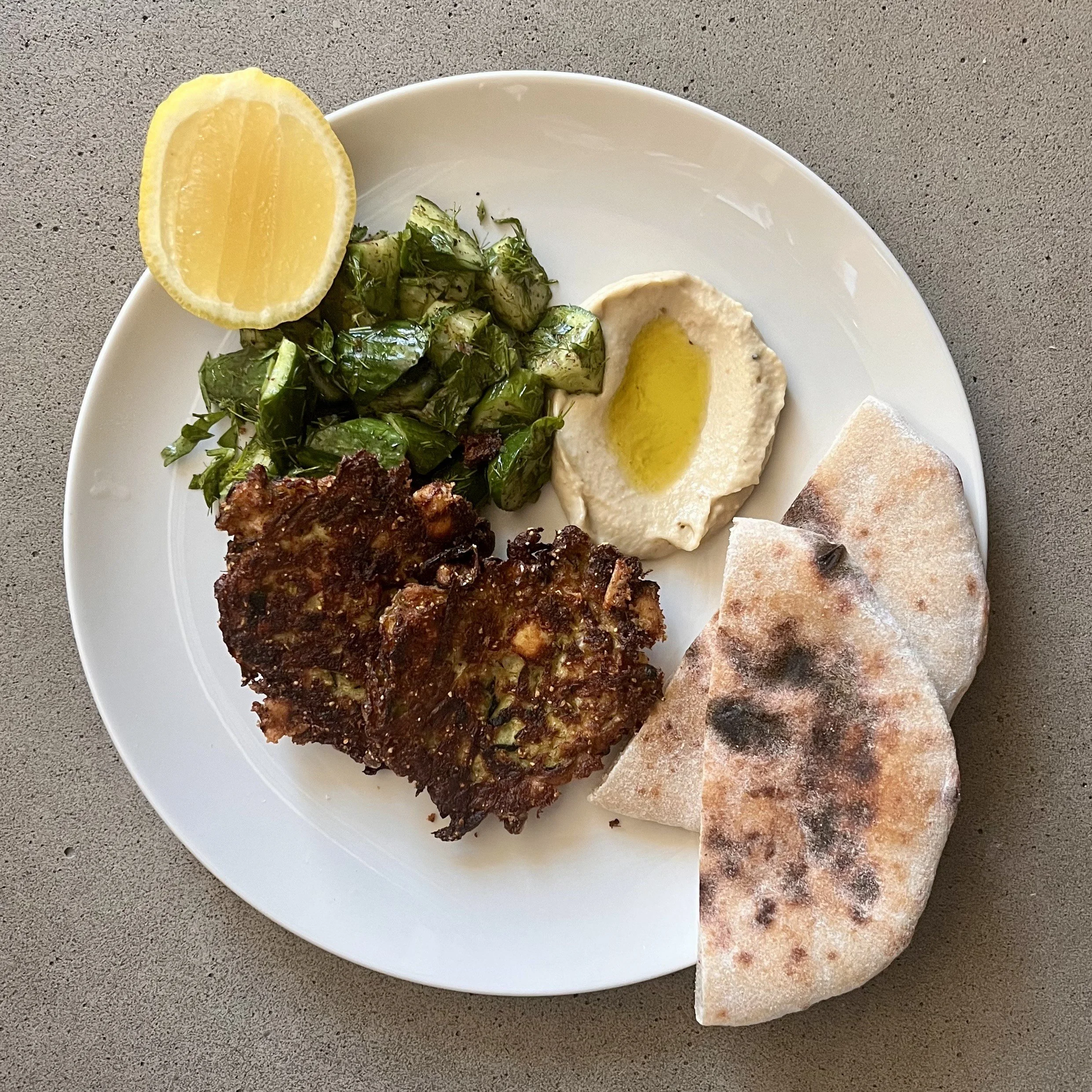 Zucchini Fritter with Baba Ganouj, Cucumber Salad &amp; Pita