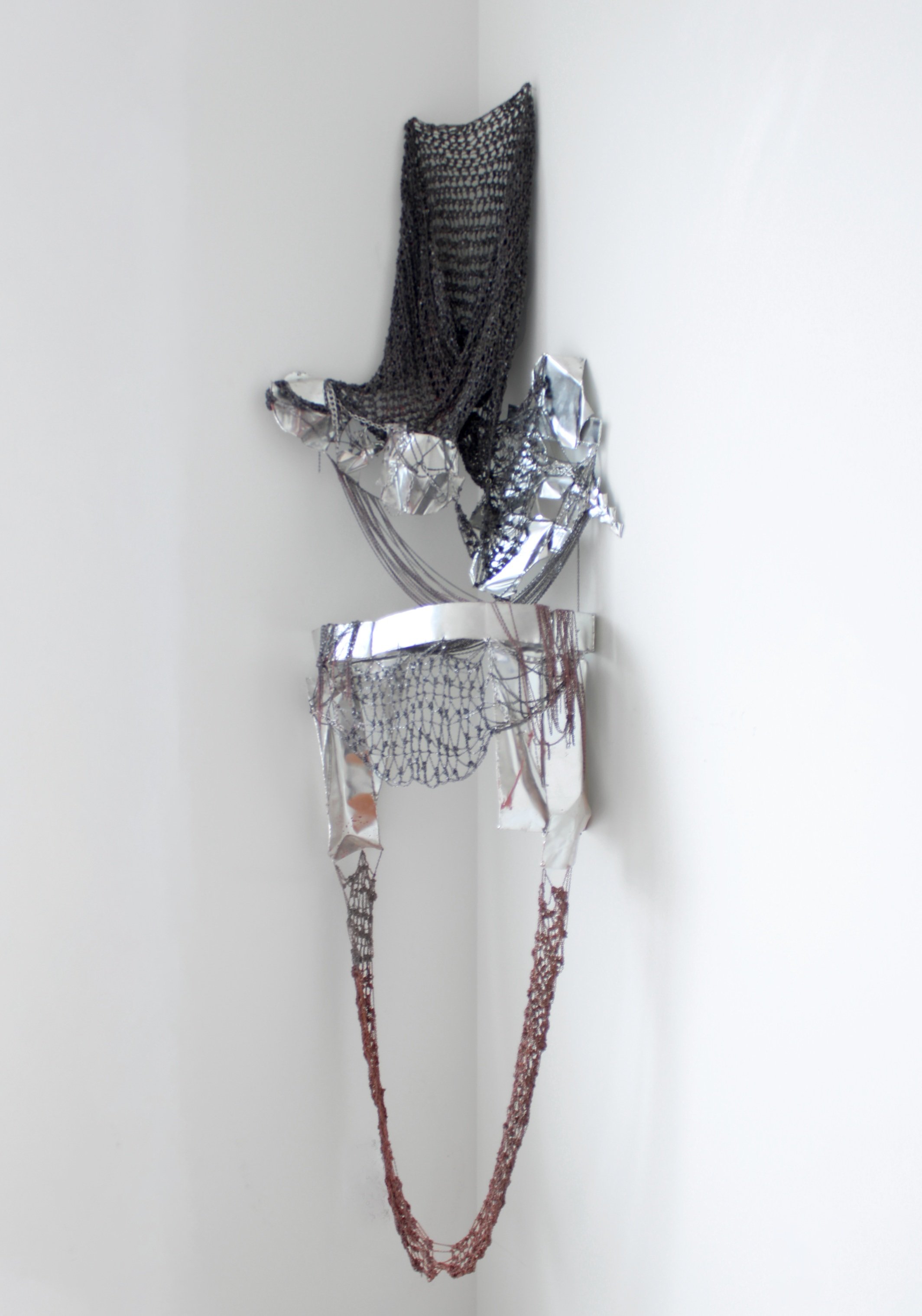Performance Piece 001, 2024, Clay, crocheted chainmail, and aluminum plates - dimensions variable