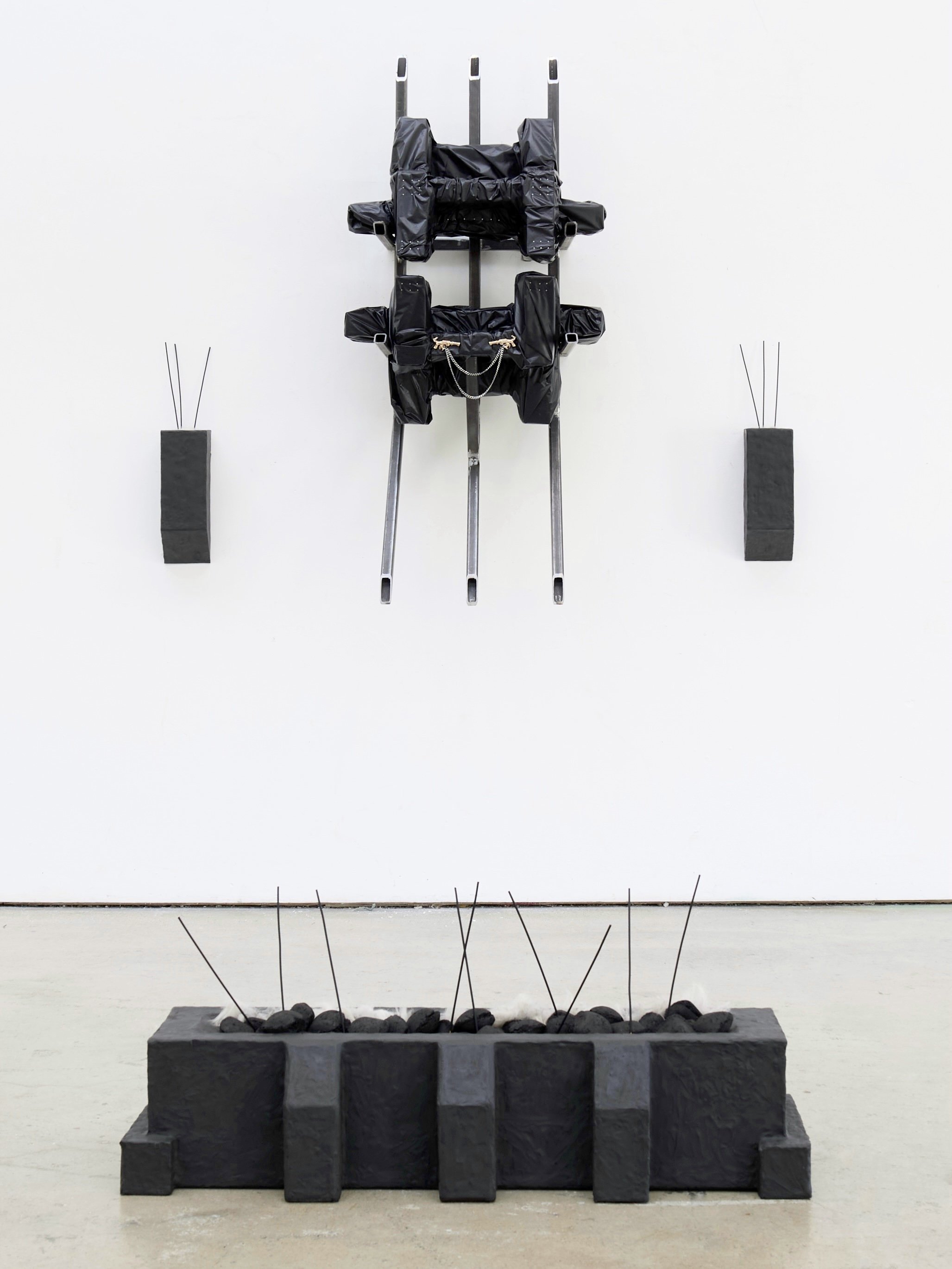 Interference, 2026, Steel, plasticine, vinyl, coal, incense, bronze, and wool - Dimensions variable