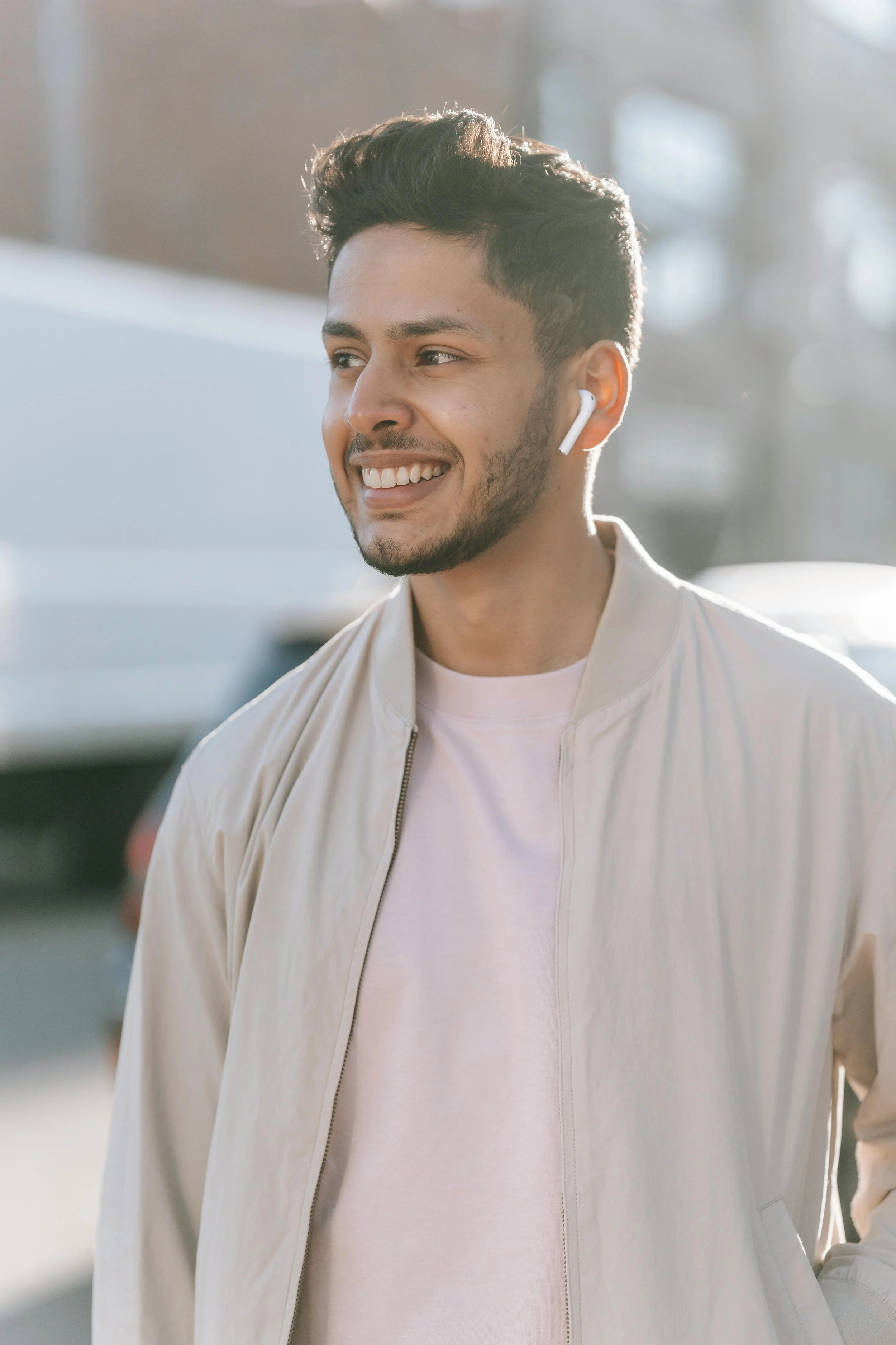 Man walking down the street smiling, representing improved confidence and self-esteem through anxiety therapy in Northern Virginia
