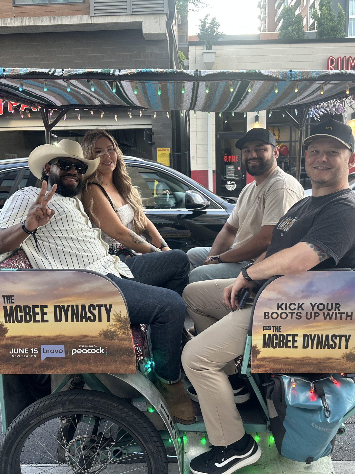 Guests ride a Pro Pedicab featuring The McBee Dynasty branding during a downtown Nashville brand activation.