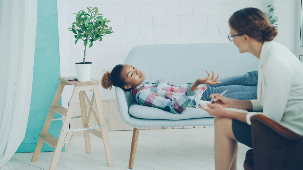 A girl does ADHD coaching with a counsellor