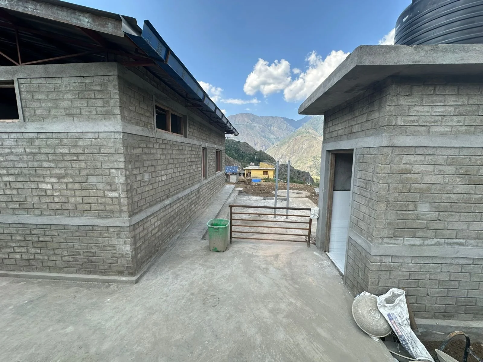 Site photo - building, external toilet and view.jpg