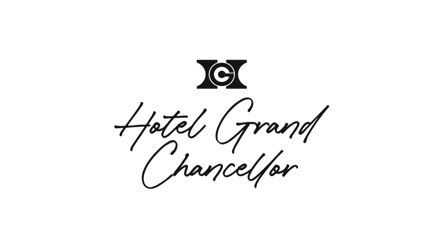 The logo of Hotel Grand Chancellor featuring a stylized champagne glass and the hotel name in elegant script.