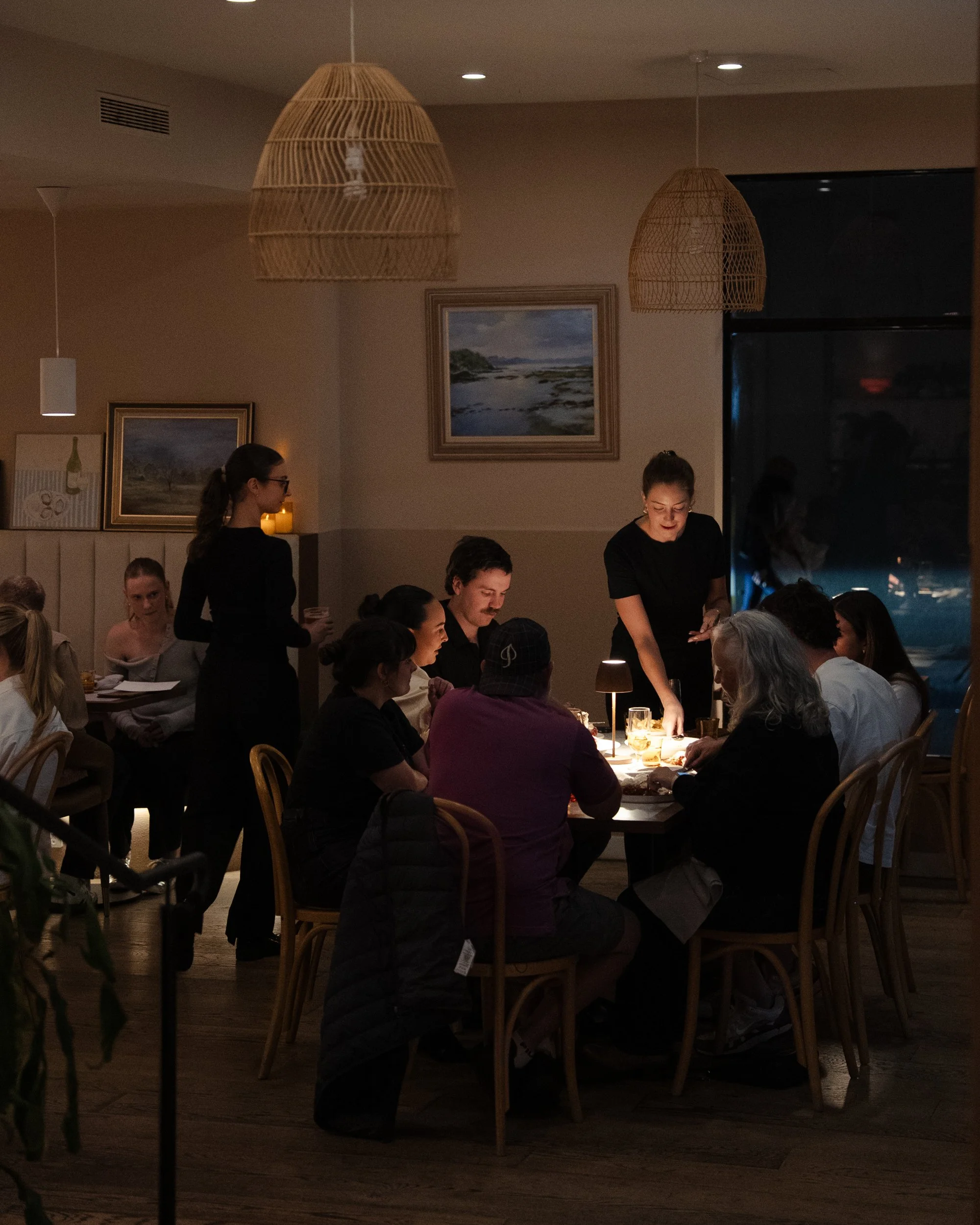 Cozy interior of Robbie's Wine Bar with warm lighting and intimate seating