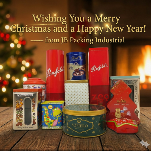 Assortment of festive holiday tin containers including Christmas tree shaped tins and luxury gift boxes from JB Packing.