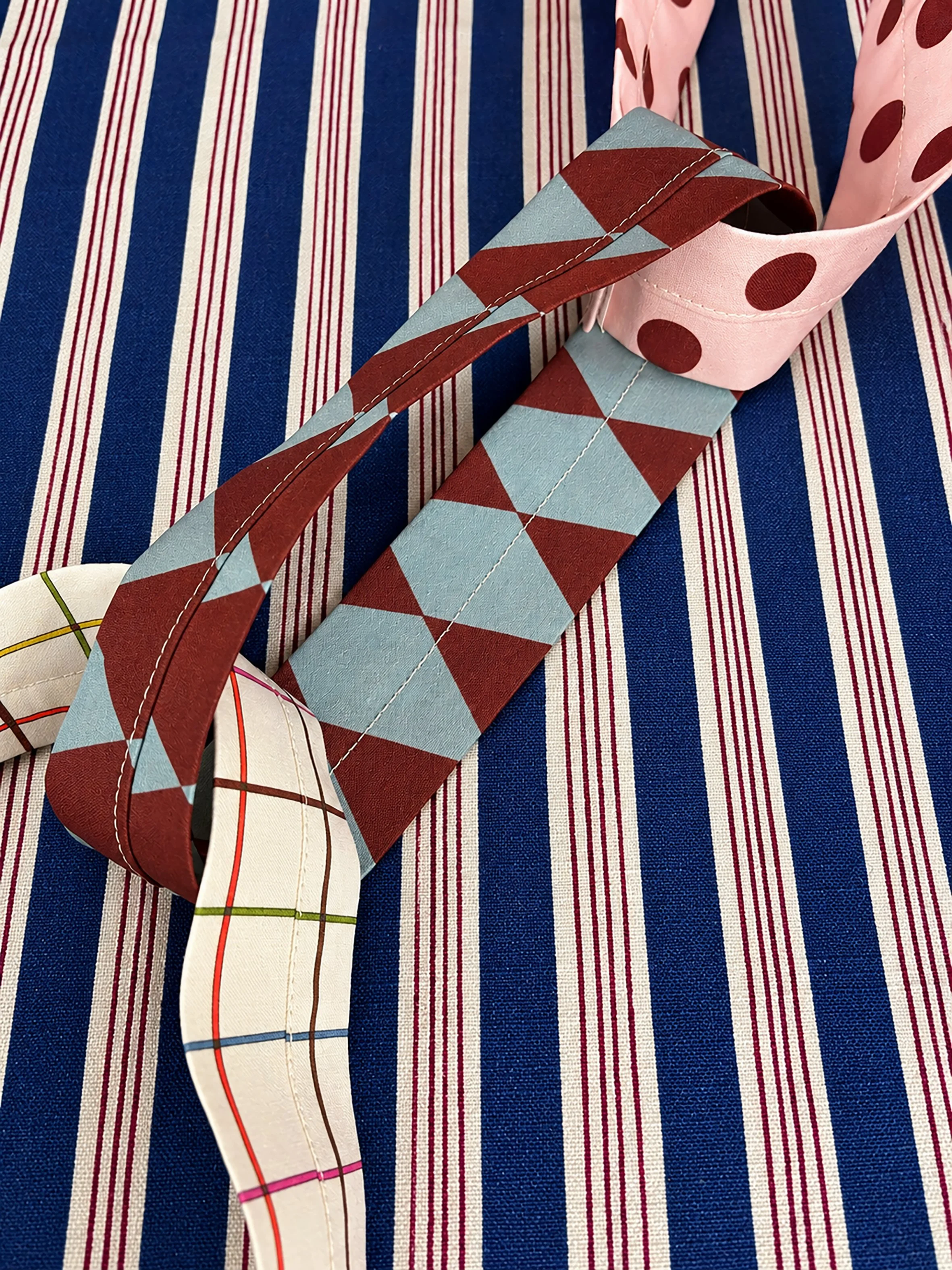 Interlinked textile loops on striped fabric (1).jpg