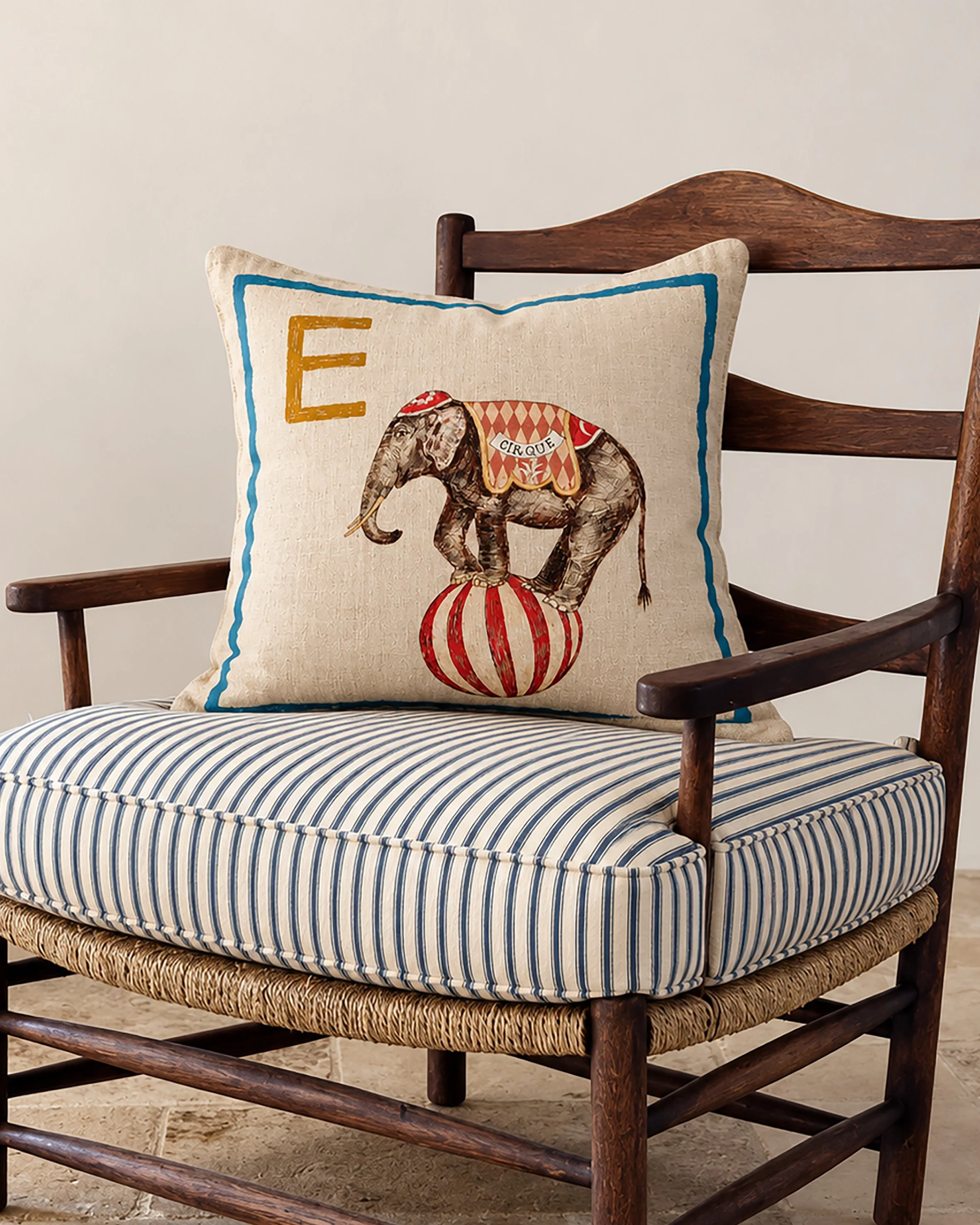 e for elephant alphabet cushuon on chair.jpg
