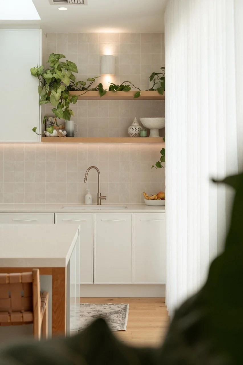 Airbnb photography of a modern Glenelg kitchen featuring timber shelves and copper fixtures, captured by an Adelaide Airbnb photographer.