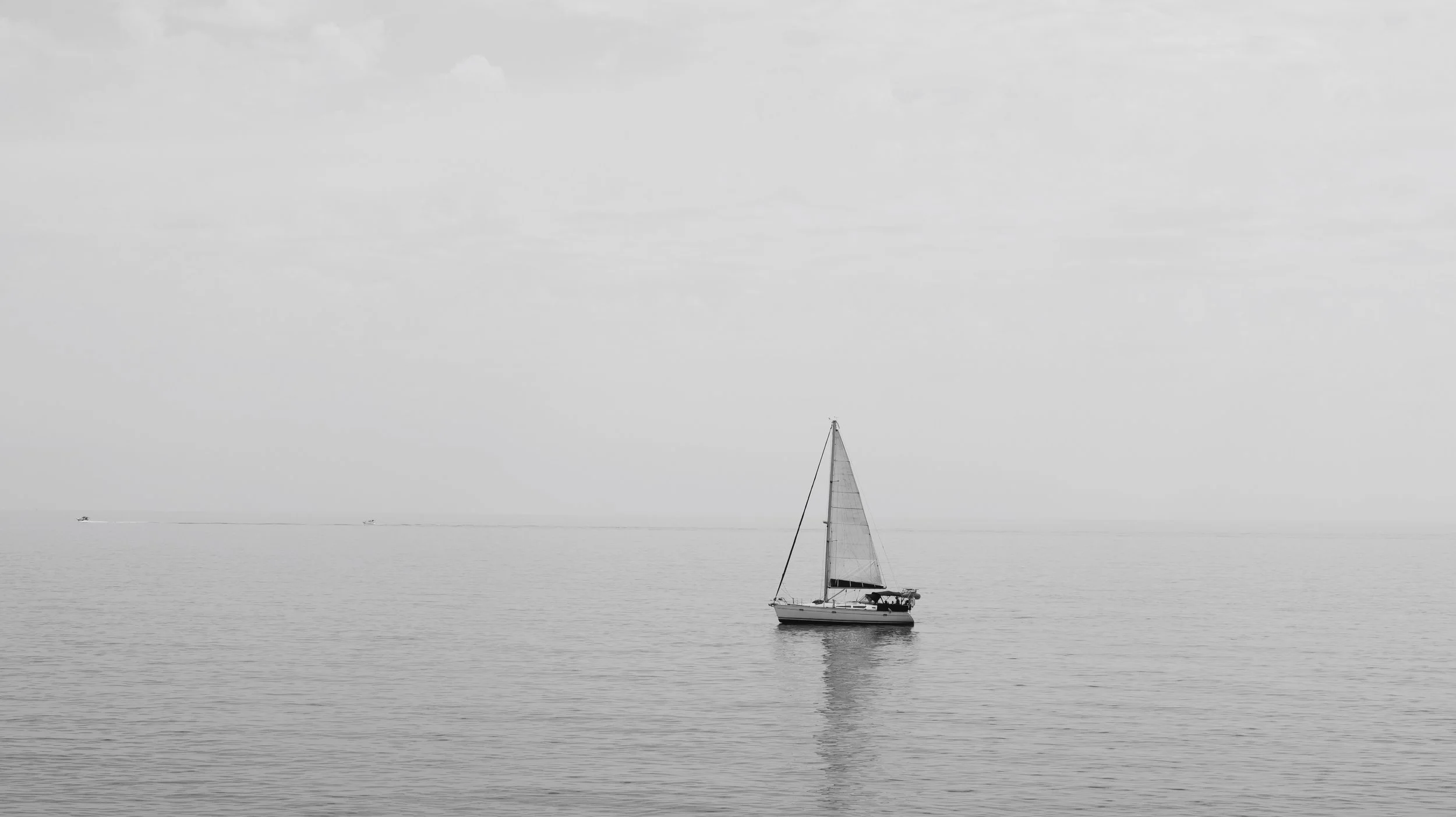 boat on the calm ocean reflection