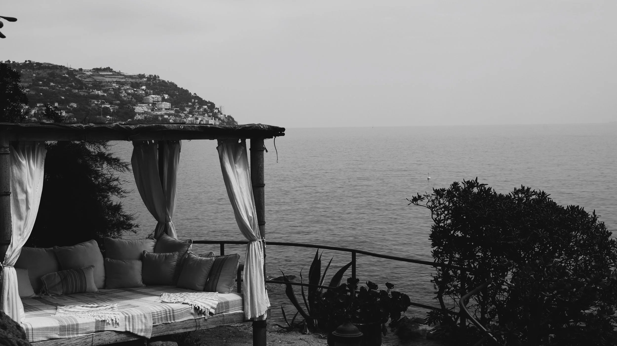 calm sea with cabin looking over the ocean