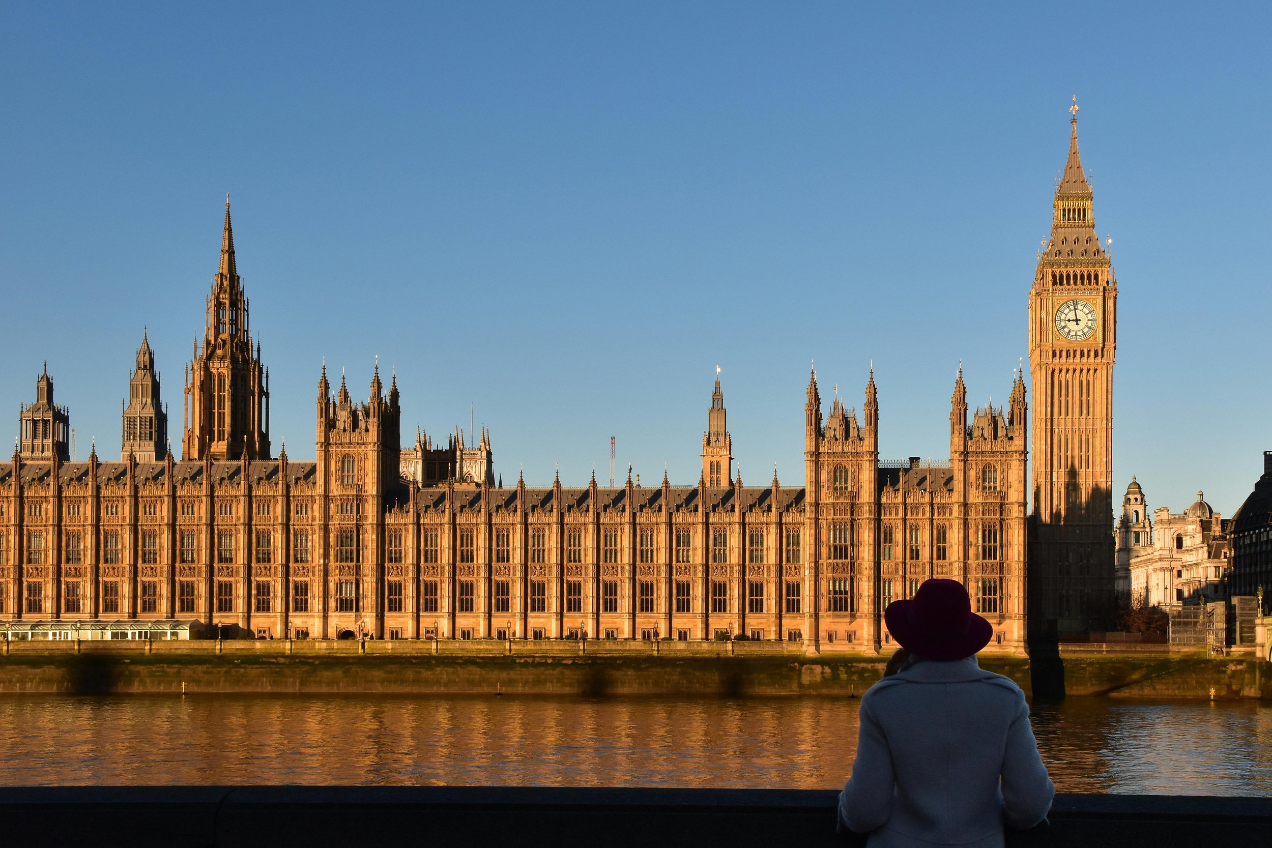 Au Pair in front of Westminster Abbey and Big Ben in London