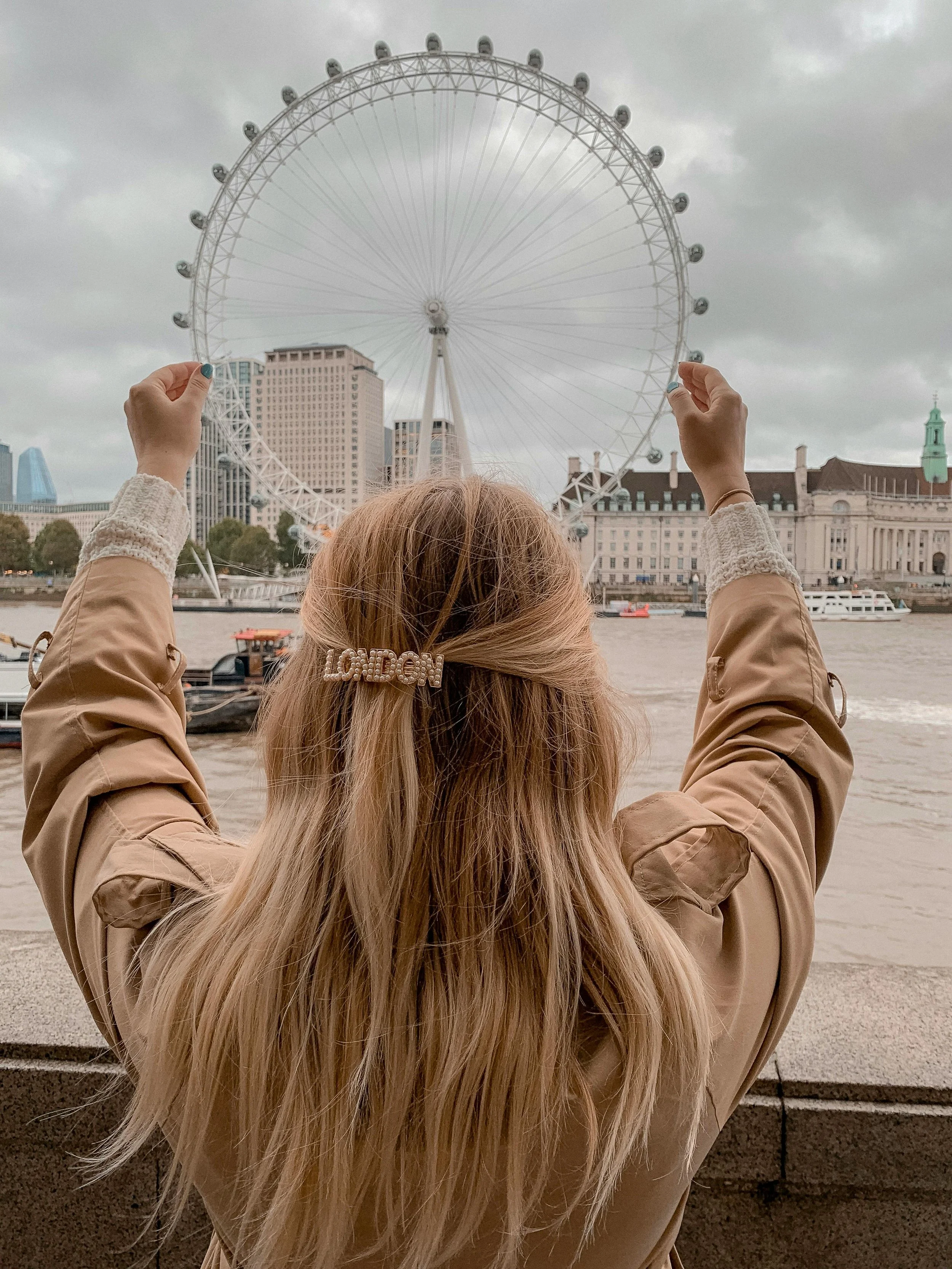An au pair in front of the London Eye