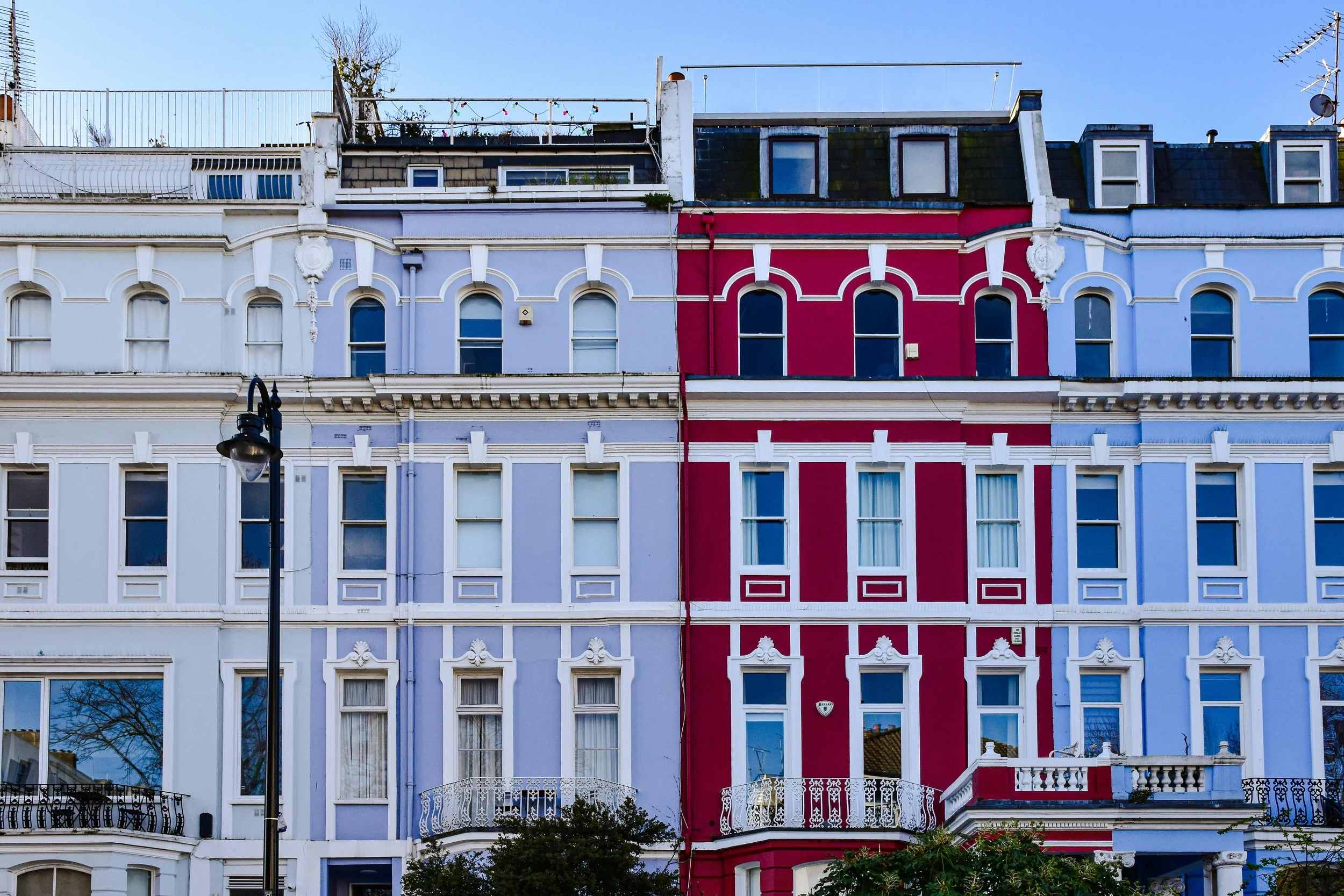 Rows of coloured houses in Chalcot Crescent and Chalcot Square