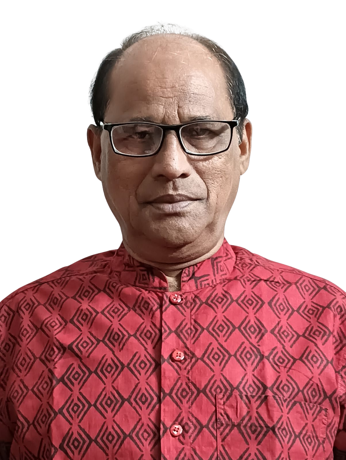 A person with dark hair wearing a light-colored shirt and patterned scarf.