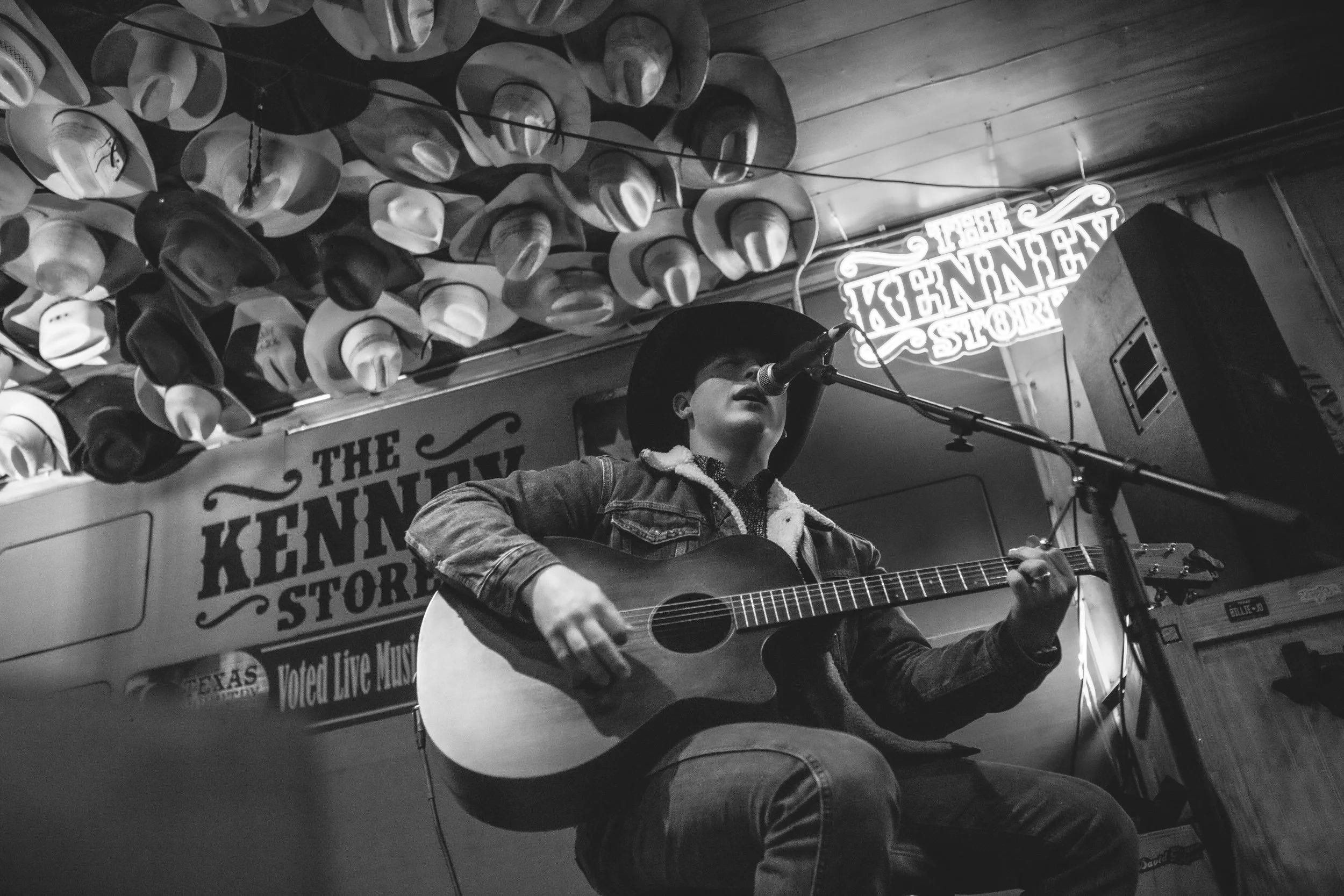 David Lewis playing acoustic guitar