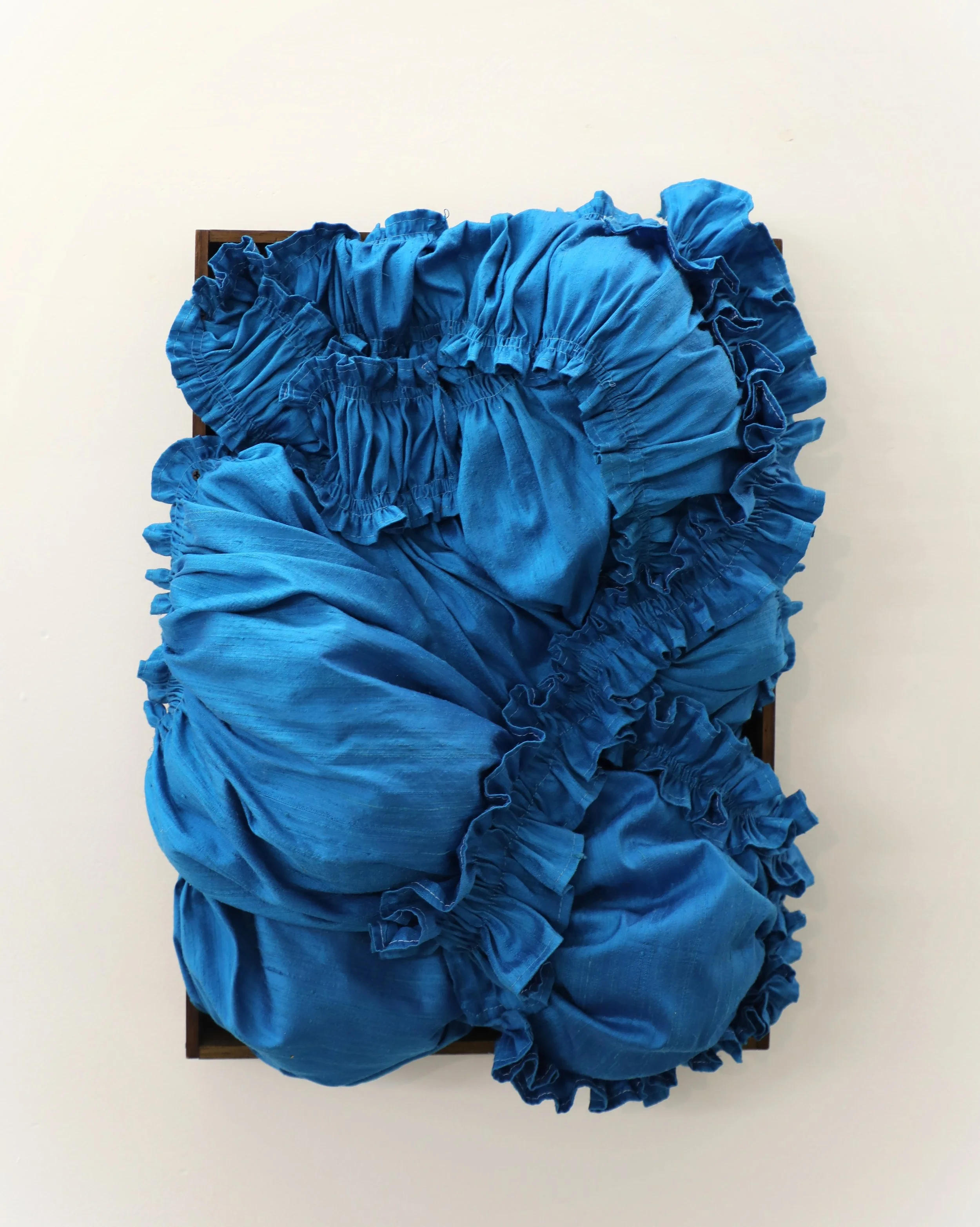 Alice, 2025, reused fiber, reused wood, 13" x 17" x 5"