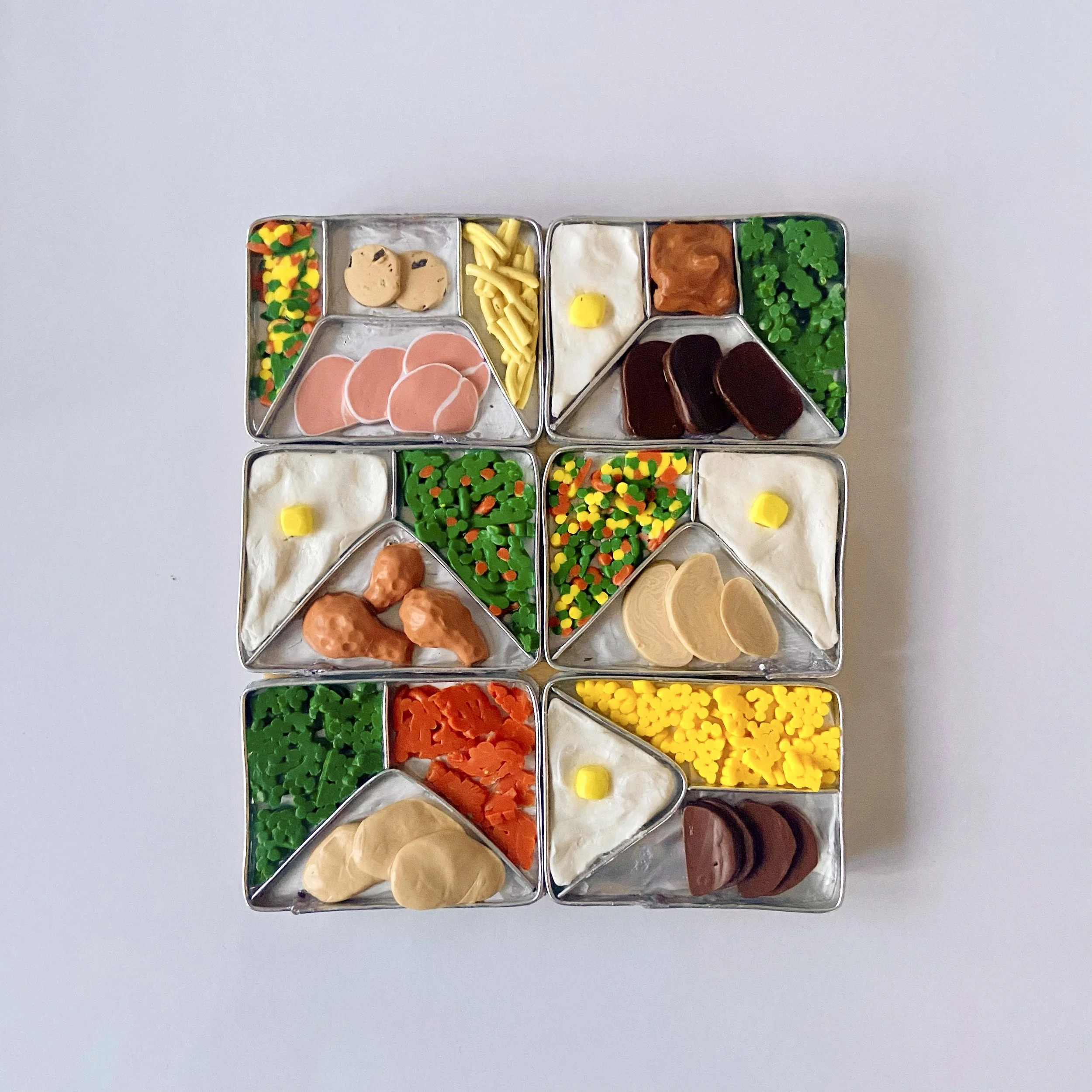 TV Dinners, 2023, clay, mixed media, 4" x 5" x .5"