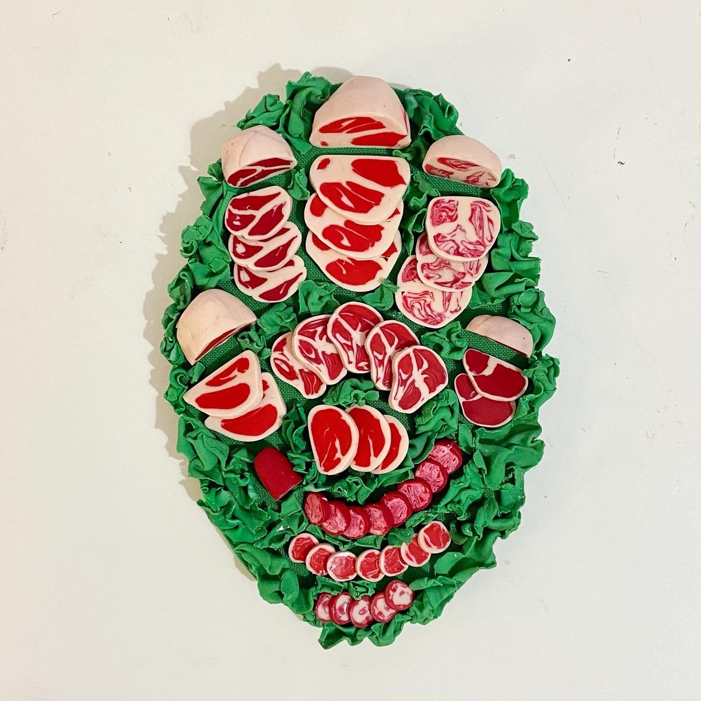 Meats, 2022, clay, mixed media, 4" x 3" x .75"